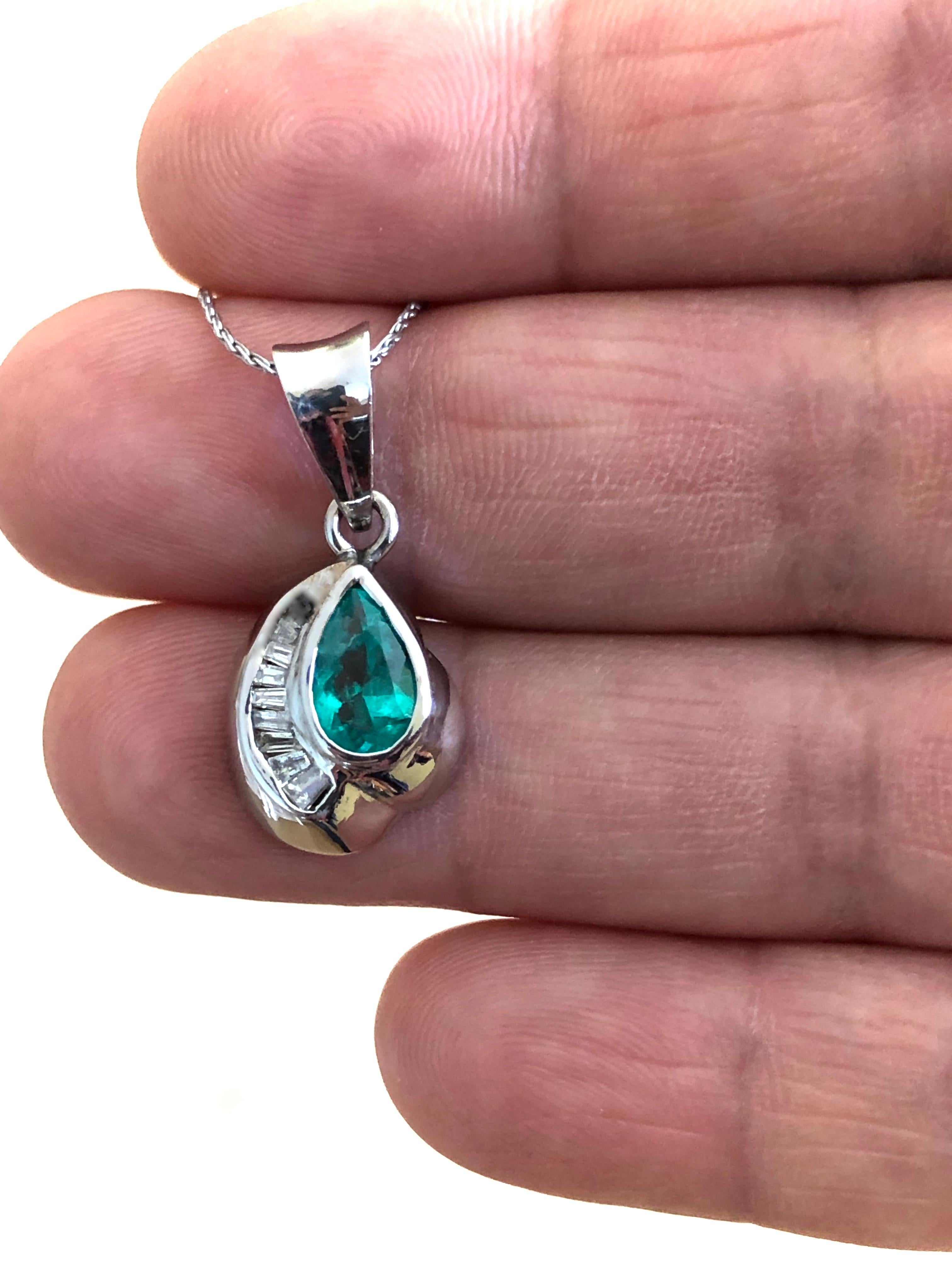 Style solitaire pendant made with a  AAA natural Colombian emerald pear cut weighing over 1.60 carat. AAA natural medium green color with stunning VS in clarity.
Accent Stones: Natural Diamond
Shape or Cut Diamond: 10 Baguette Cut 
Average