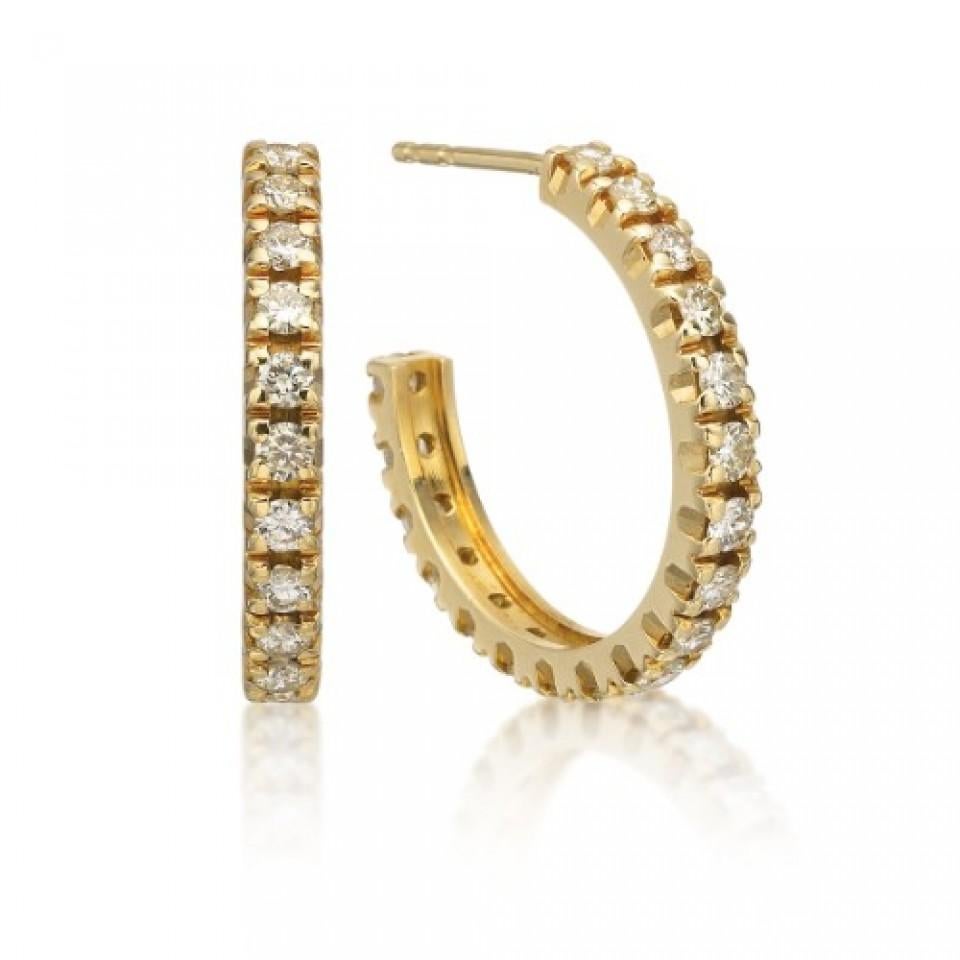These diamond earrings will sparkle with every move of the head. Crafted in striking 18K yellow gold, these splashy earrings have 1.80ctw round brilliant cut diamonds  (H-I color with SI clarity) cascading around the hoop. These diamond J-hoops are