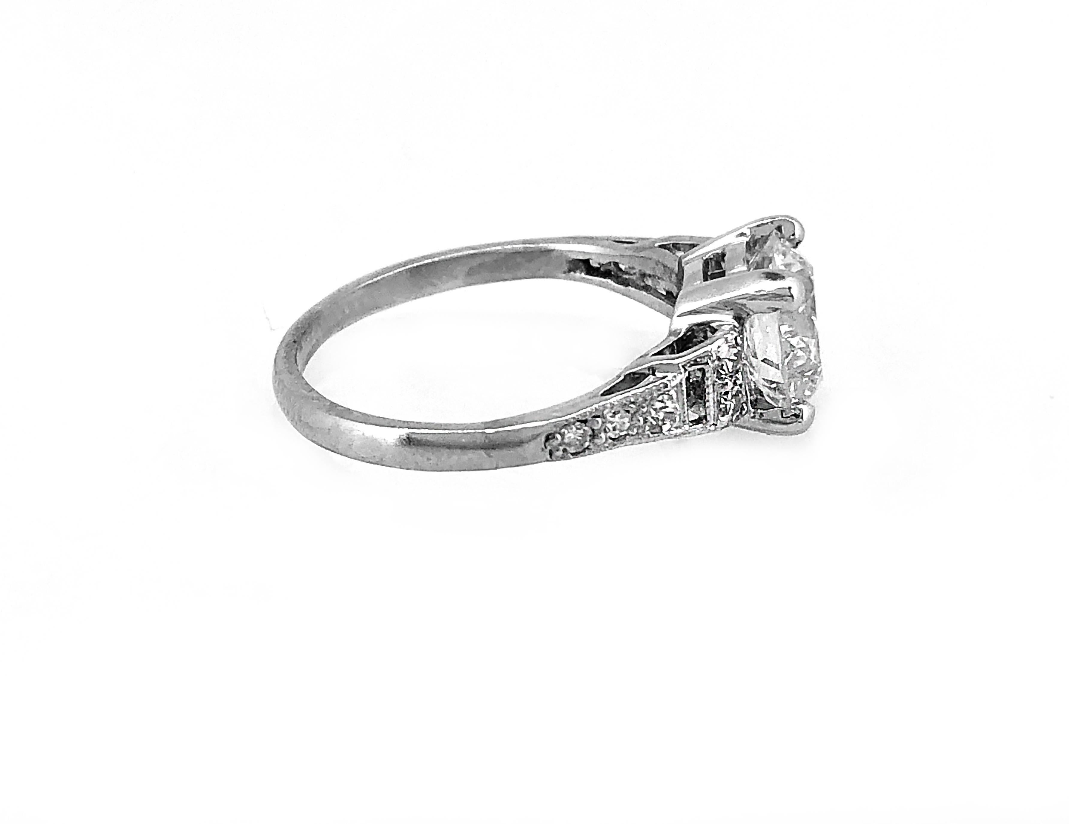A striking Art Deco diamond Antique engagement ring that features a dazzling 1.80ct. apx. European cut diamond with VS2 clarity and J color. The center stone is accented by bright and lively single cut diamonds weighing .25ct. apx. T.W. with VS2-SI1