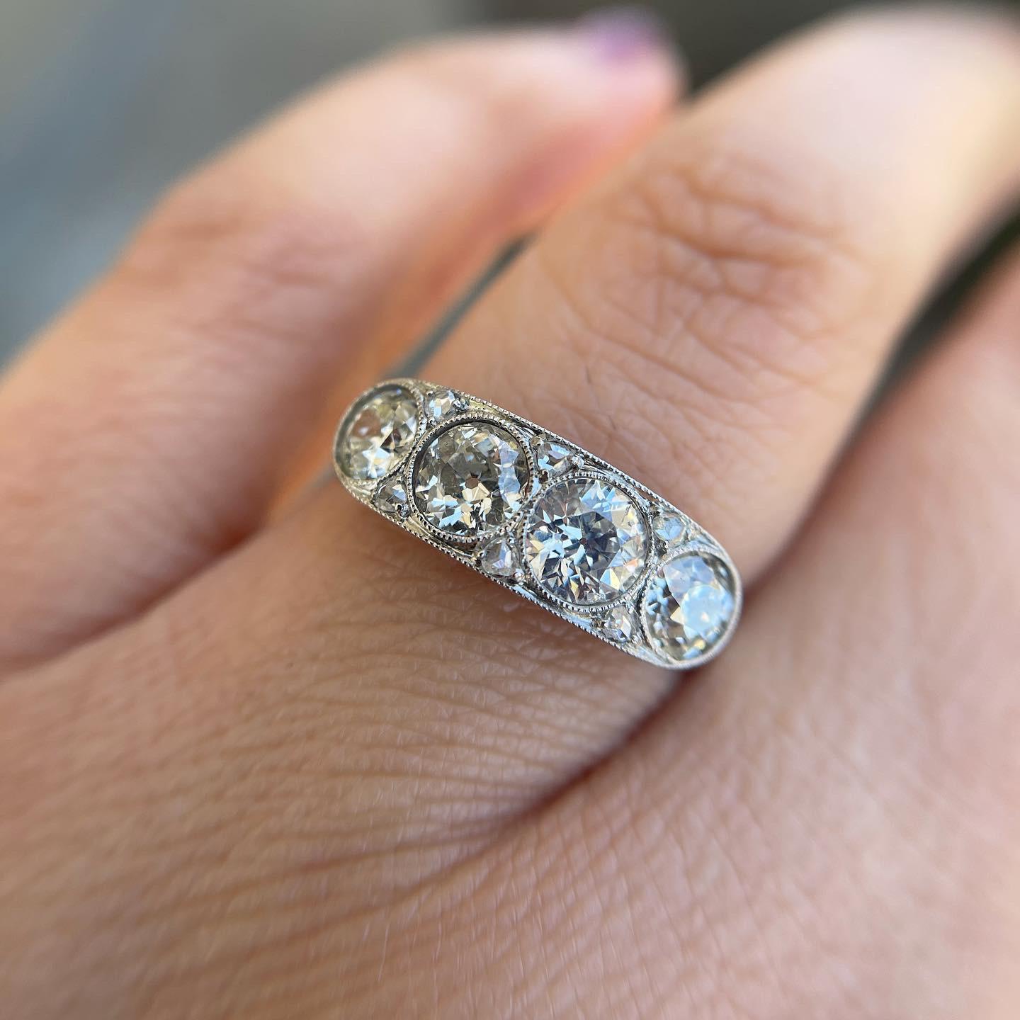 Edwardian Diamond Four-Stone Platinum Ring Estate Fine Jewelry In Excellent Condition In Montreal, QC