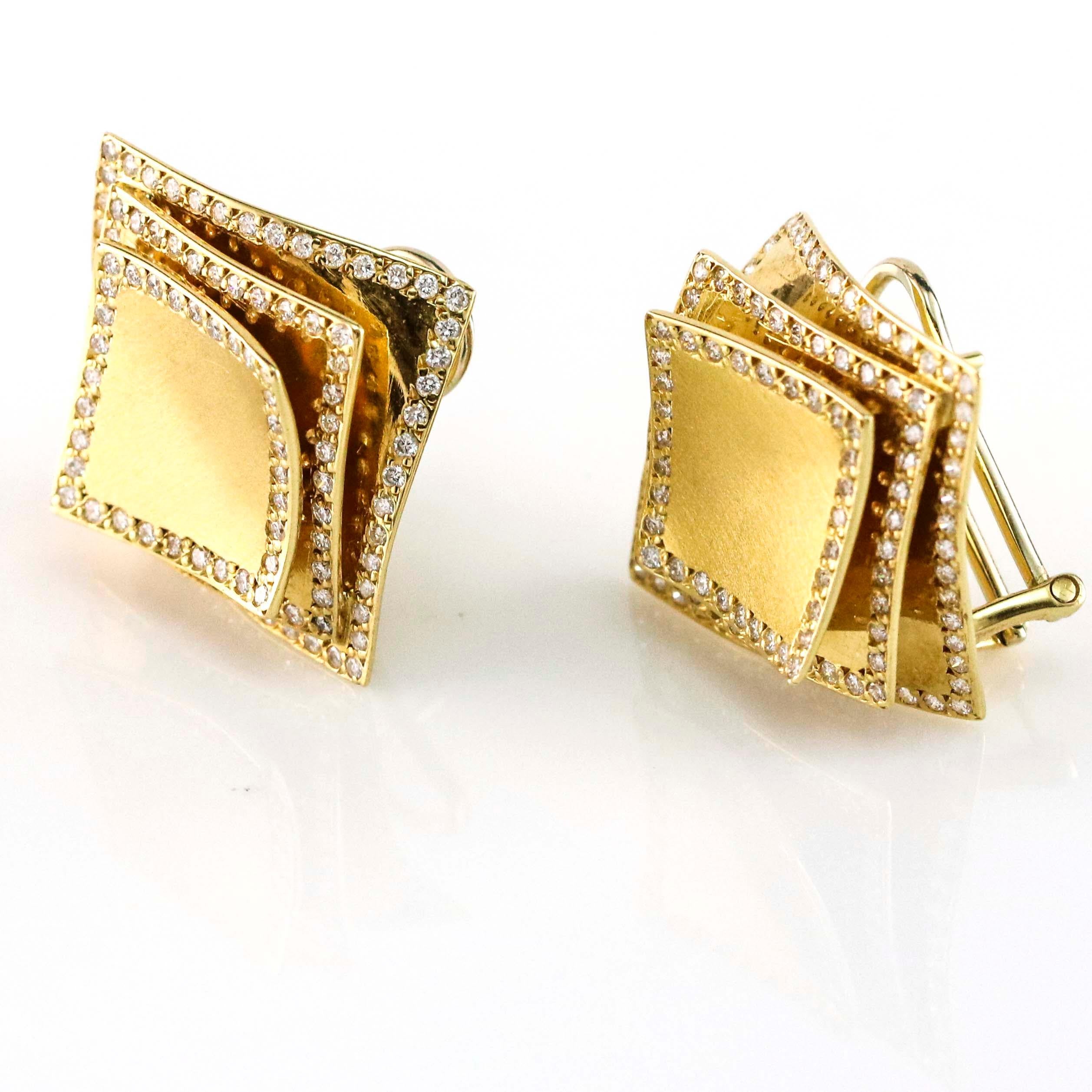 Delicate stud earrings with diamonds on edges of each gold layer. Omega backs. Signed FR. Estimated total carat weight, 1.80 carats.