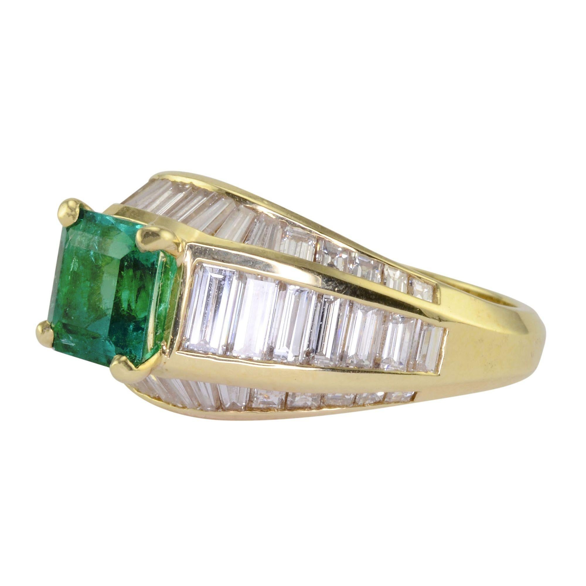 Estate 1.80 carat emerald and diamond ring. This 18 karat yellow gold ring has one square cut emerald at 1.80 carats and 50 baguette diamonds at 2.50 carat total weight VS1-2 clarity F-G color. The emerald ring is a size 6.5. This emerald diamond