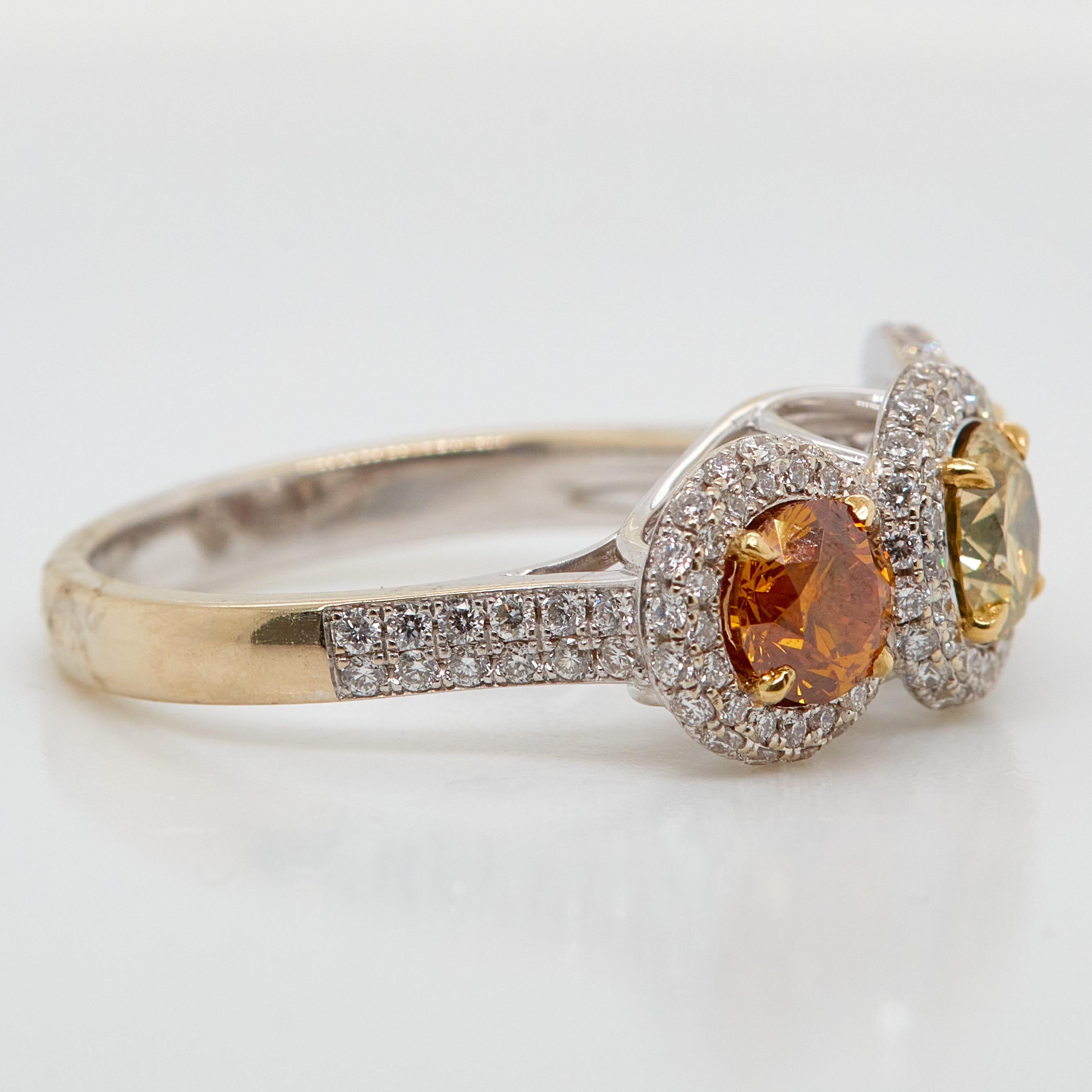 Circles of diamonds in timeless elegance. This ring set with three GIA certified natural fancy color diamonds. A 0.63 carat circular-cut fancy deep brownish yellow diamond, flanked by a 0.60 carat similarly-cut fancy deep yellowish orange diamond