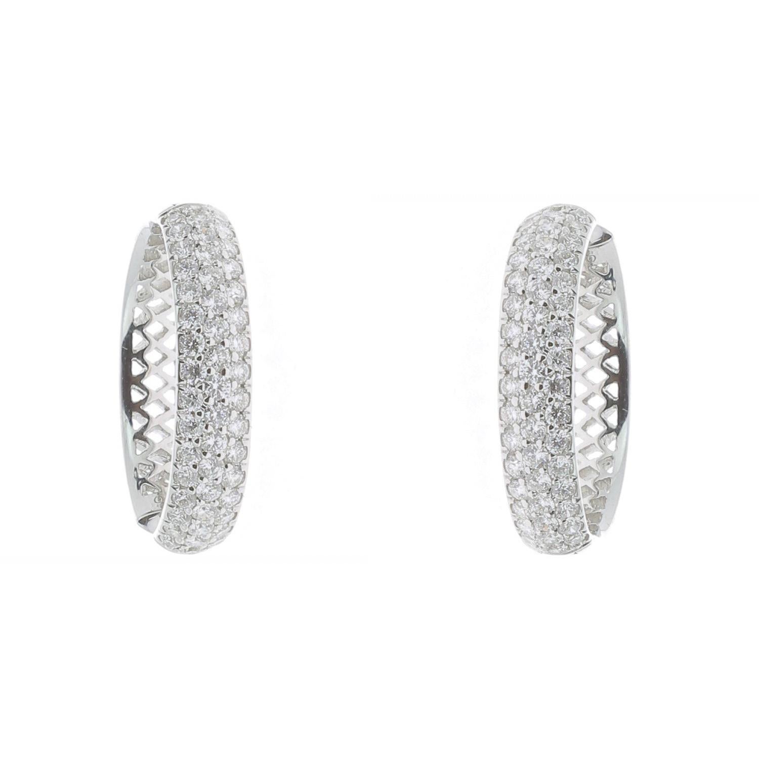 The Diamond hoop earrings are set with 98 round diamonds in three row weighing 1.80 carat. 
The Hoop Diamond Earrings are set in 18K White Gold and weight 7.01 Grams.
The Diamond Hoops Earrings will come in a beautiful box ready for