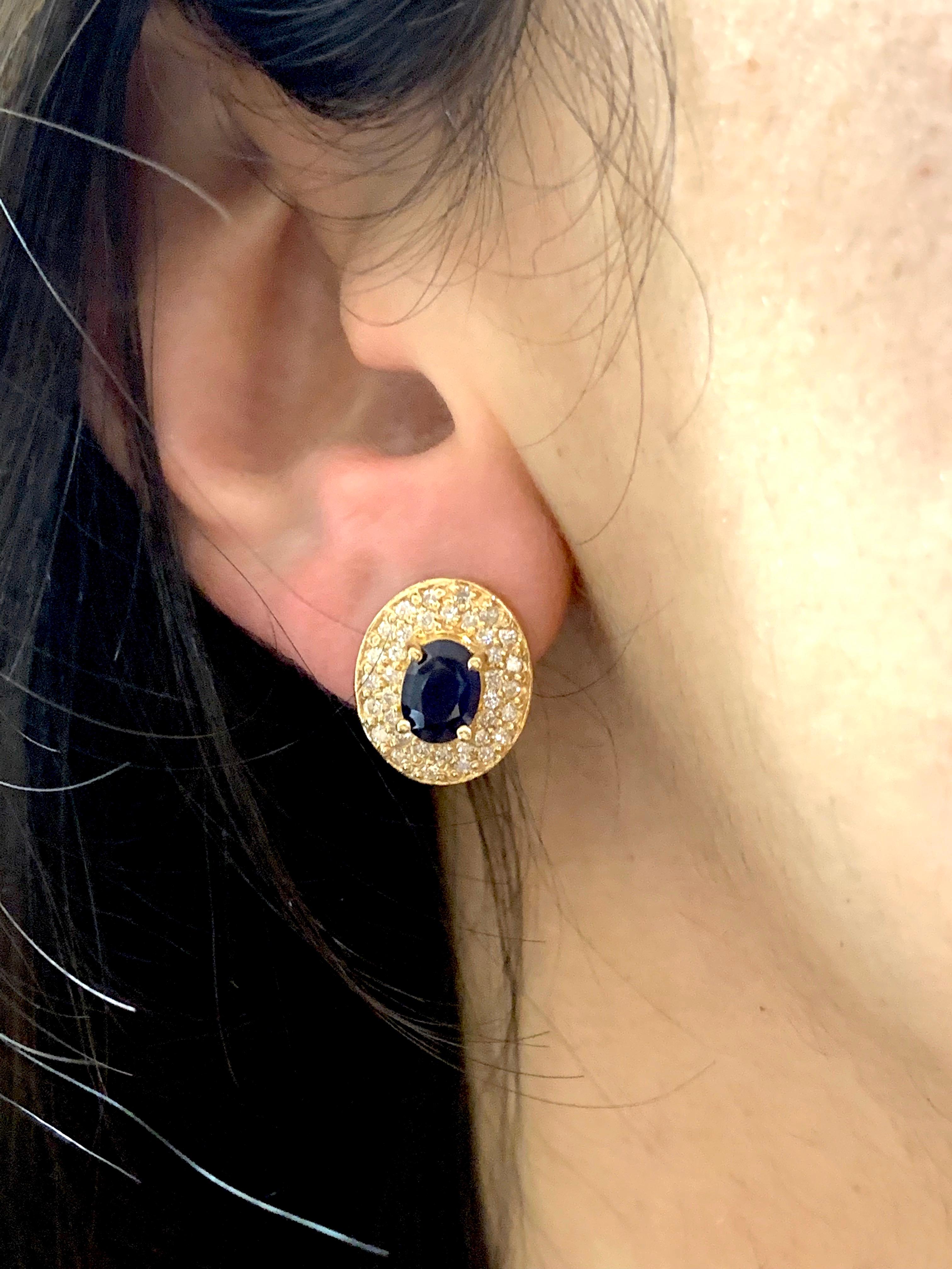 Contemporary 1.80 Carat Oval Blue Sapphire and .72 Carat Diamond Earrings