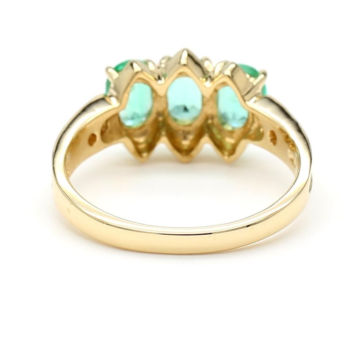 Contemporary 1.80 Carat Oval Emerald 3 Stone Ring in 14K Gold For Sale