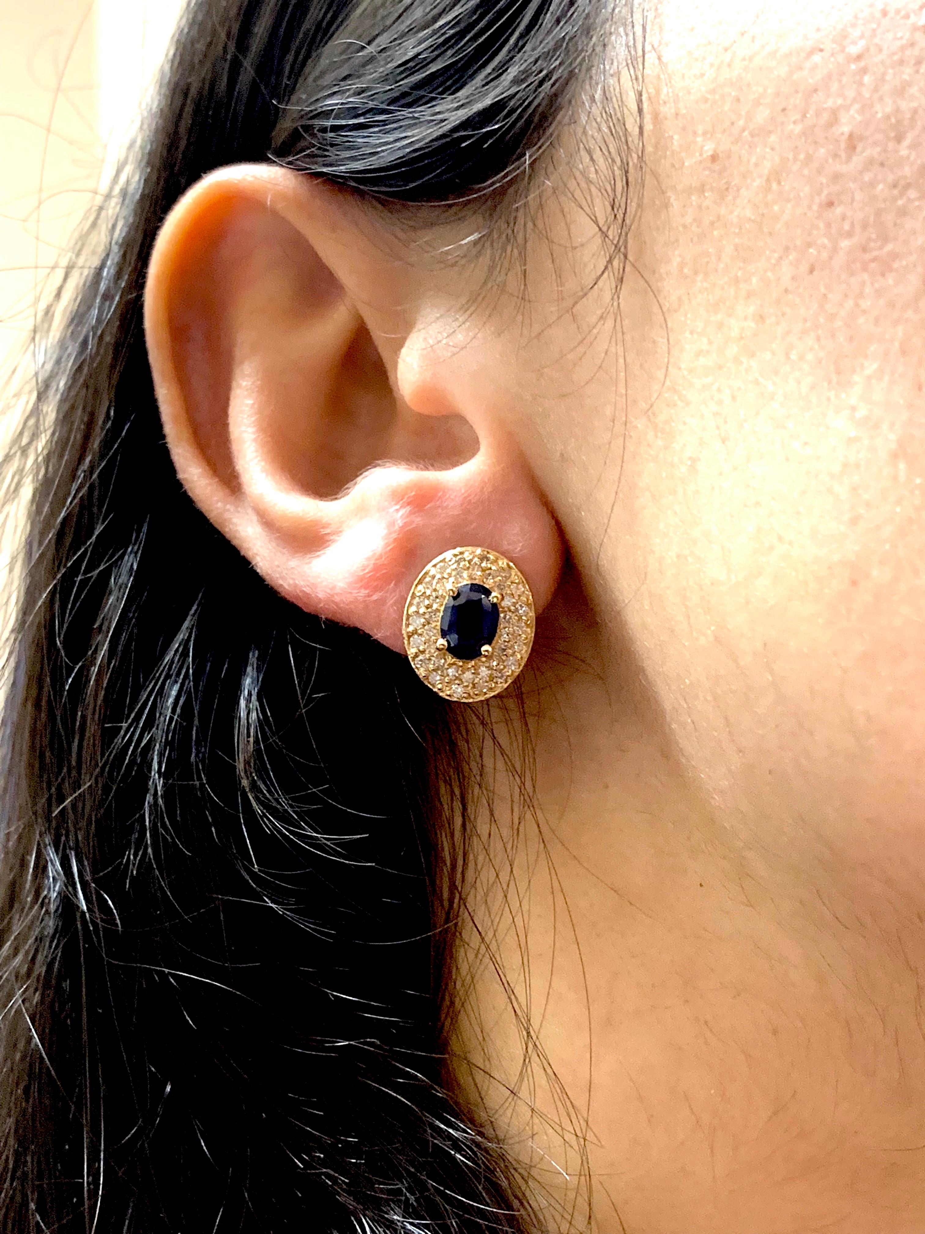 Contemporary 1.80 Carat Oval Blue Sapphire and .72 Carat Diamond Earrings