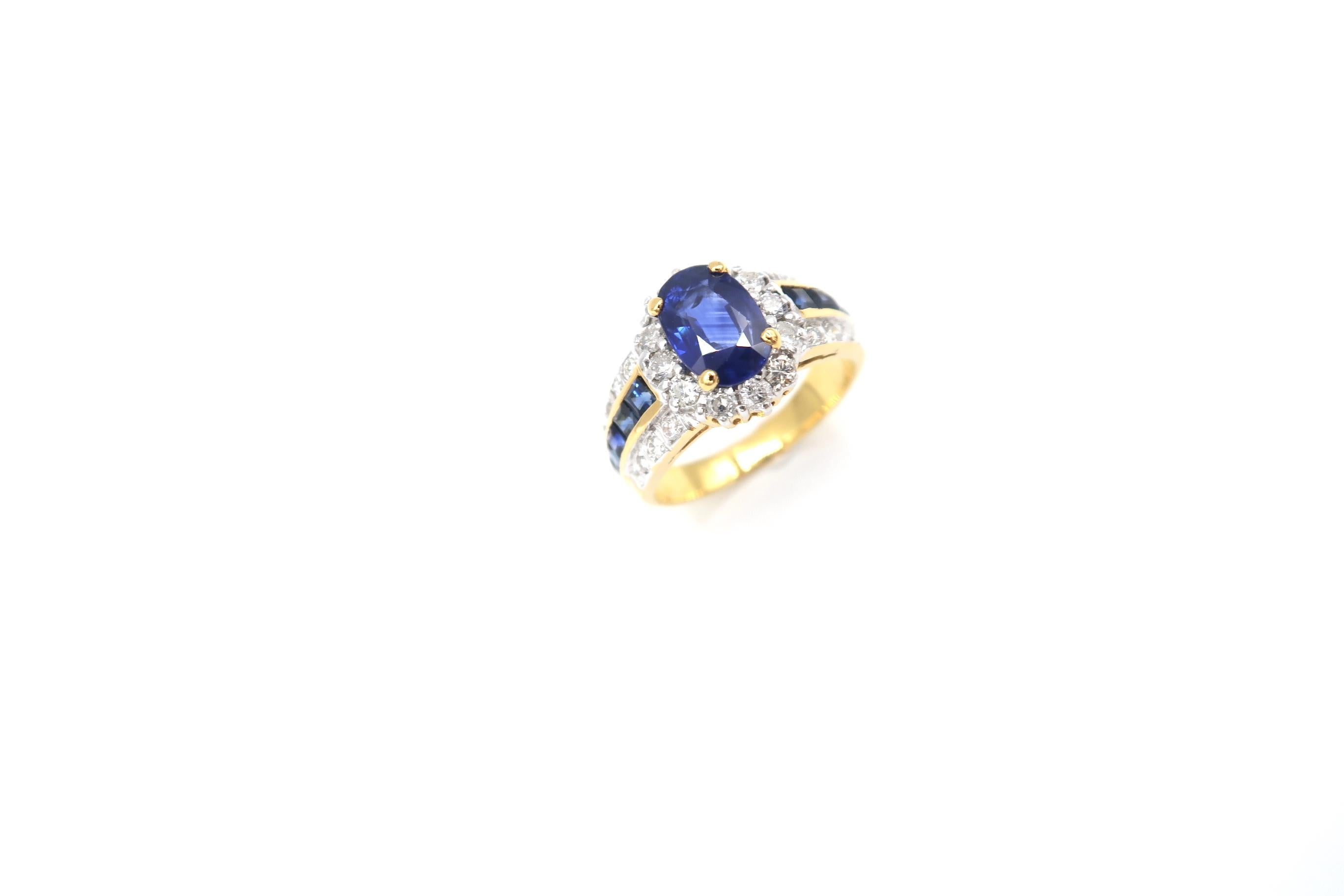 1.80 Carat Oval Sapphire and Diamond Halo 18K Gold Ring with Lined Princess-Cut Sapphire and Diamond Band 

Ring size: 55

Sapphire: Centre 1.80ct.
Sapphire: 0.80ct.
Diamond: 0.80ct.
Gold: 18K 6.20g.