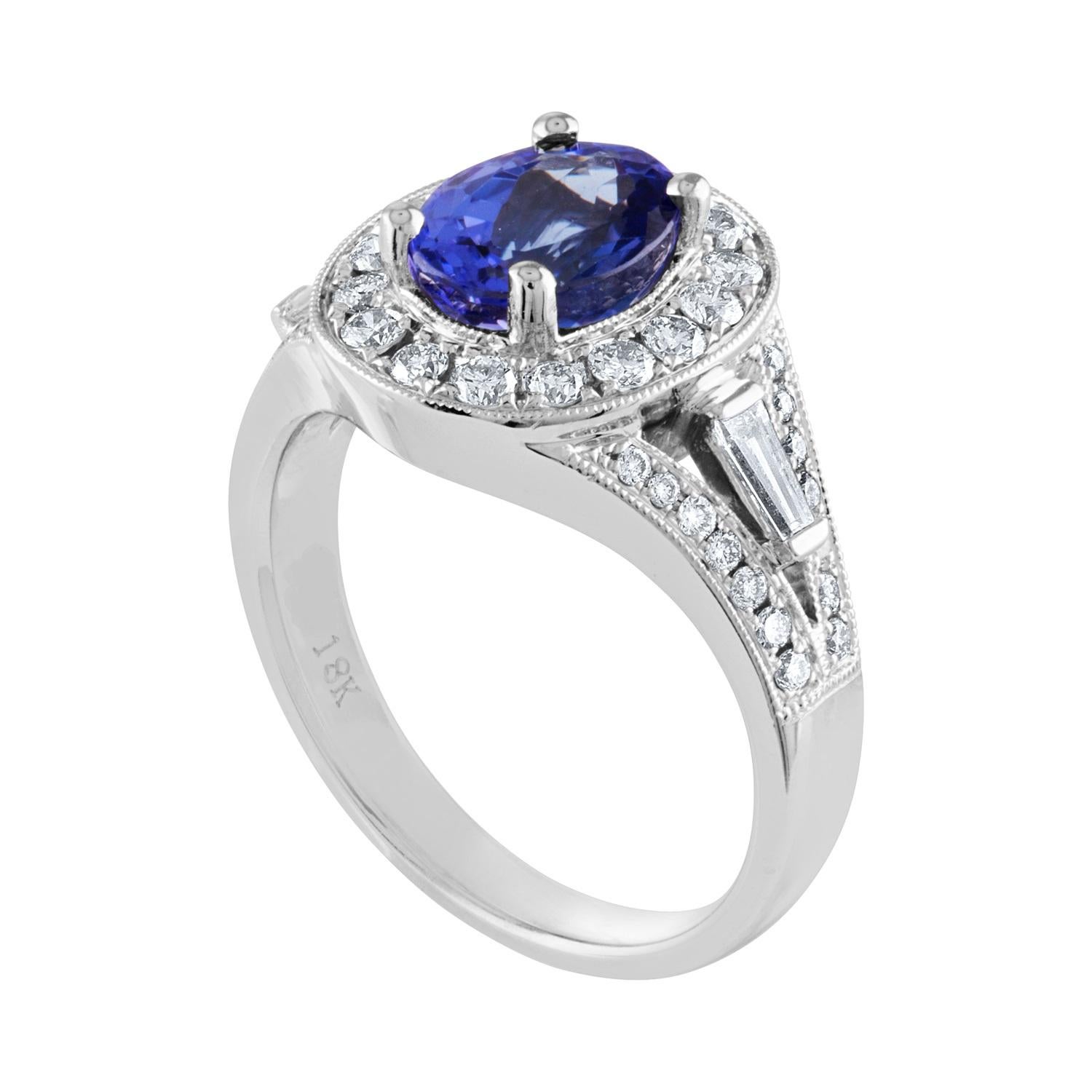 Beautiful Oval Tanzanite Halo Ring
The ring is 18K White Gold
The Oval Tanzanite is 1.80 Carats
There are 0.80 Carats in Diamonds G/H VS
The ring is a size 6.00, sizable.
The ring weighs 6.8 grams.