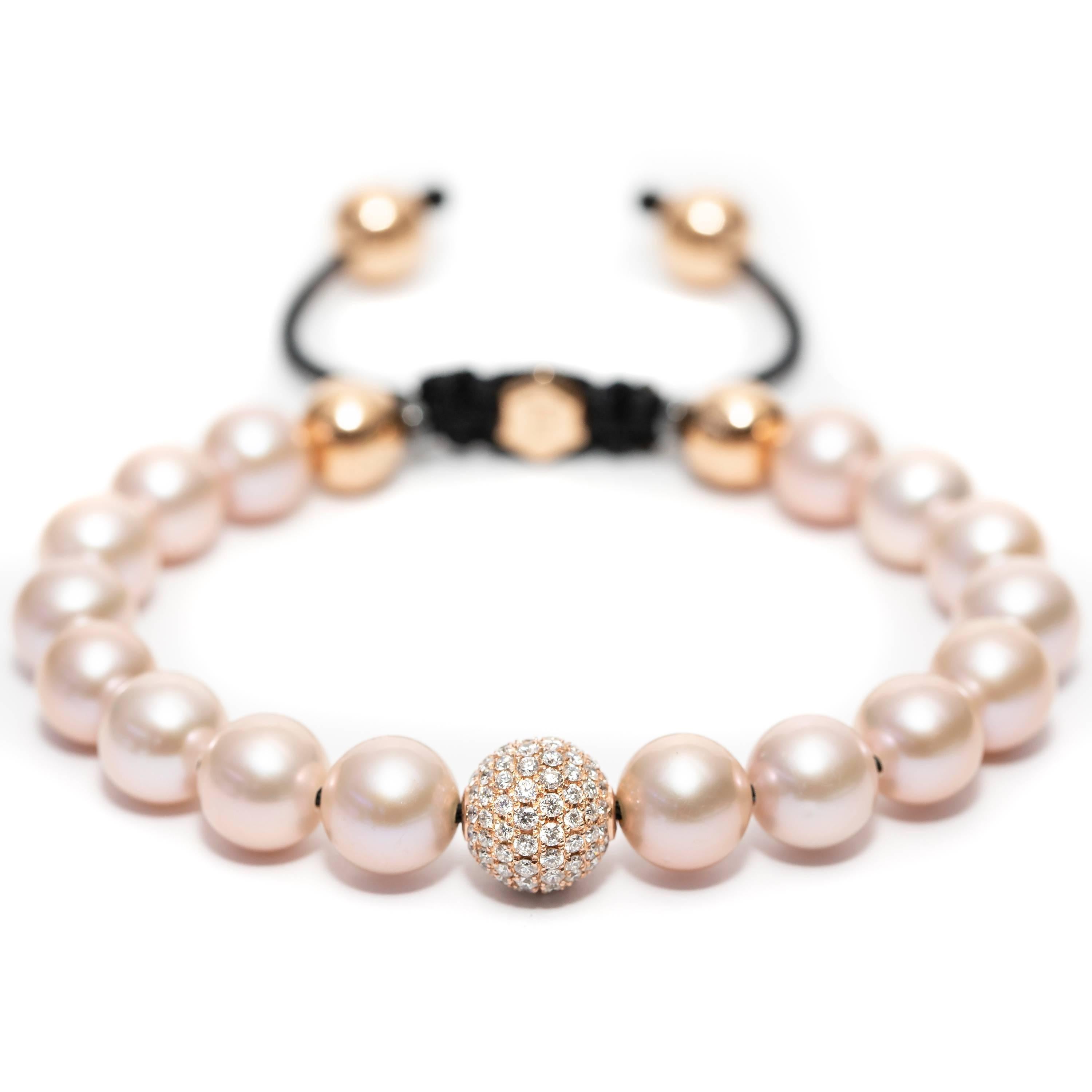 This Contemporary fresh water Pearl Bracelet features an adjustable Cord further highlighted with a Pave set 1.80 Carat Round Brilliant Color G Clarity VS Diamond sphere set in 18 Karat Rose Gold for a luxurious feel. Available in a choice of sizes,