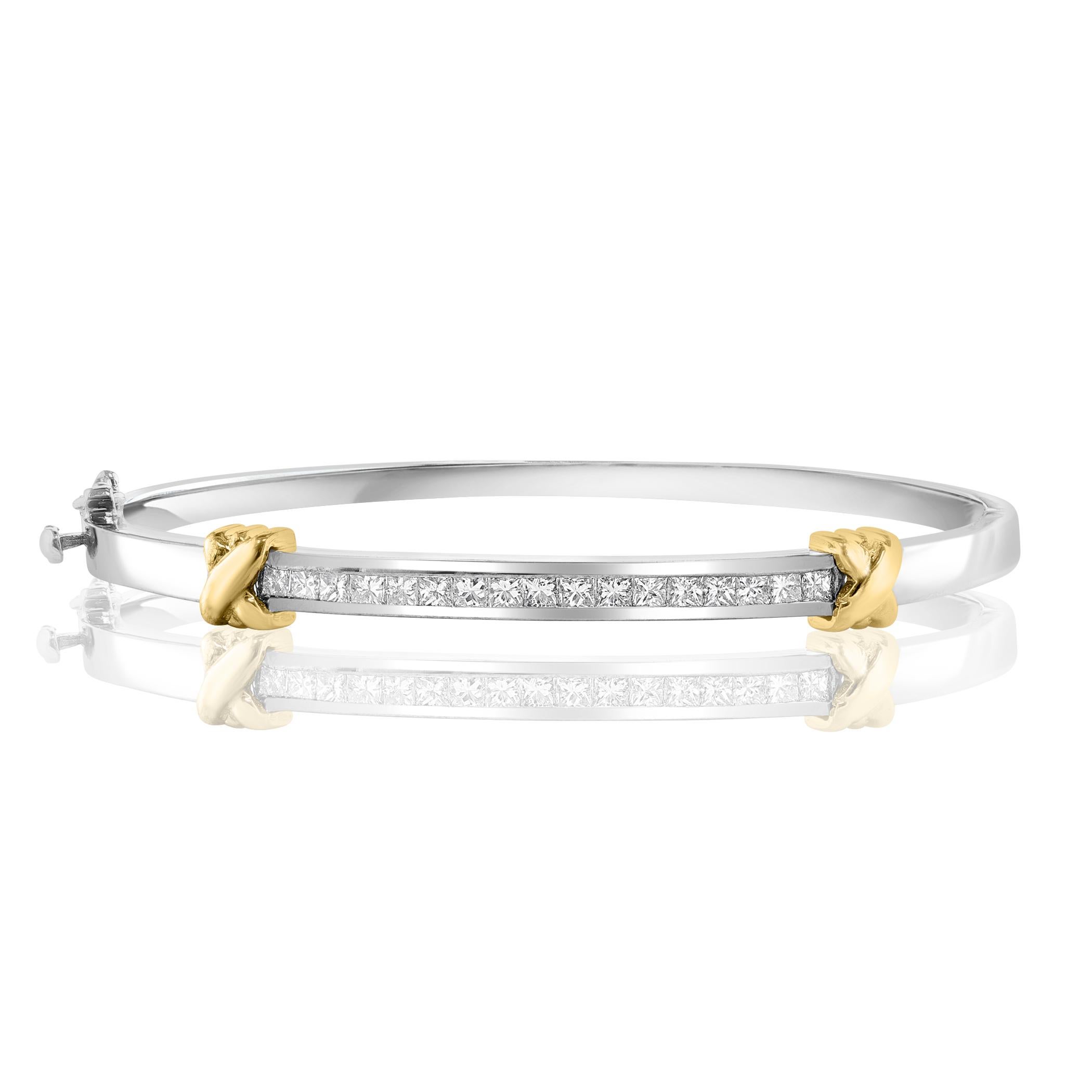 A stunning bangle set with 17 sparkling princess cut diamonds weighing 1.80 carats total. Set in polished 14k mix gold. Double lock mechanism for maximum security. A simple yet dazzling piece.

All diamonds are GH color SI1 Clarity.
Style available