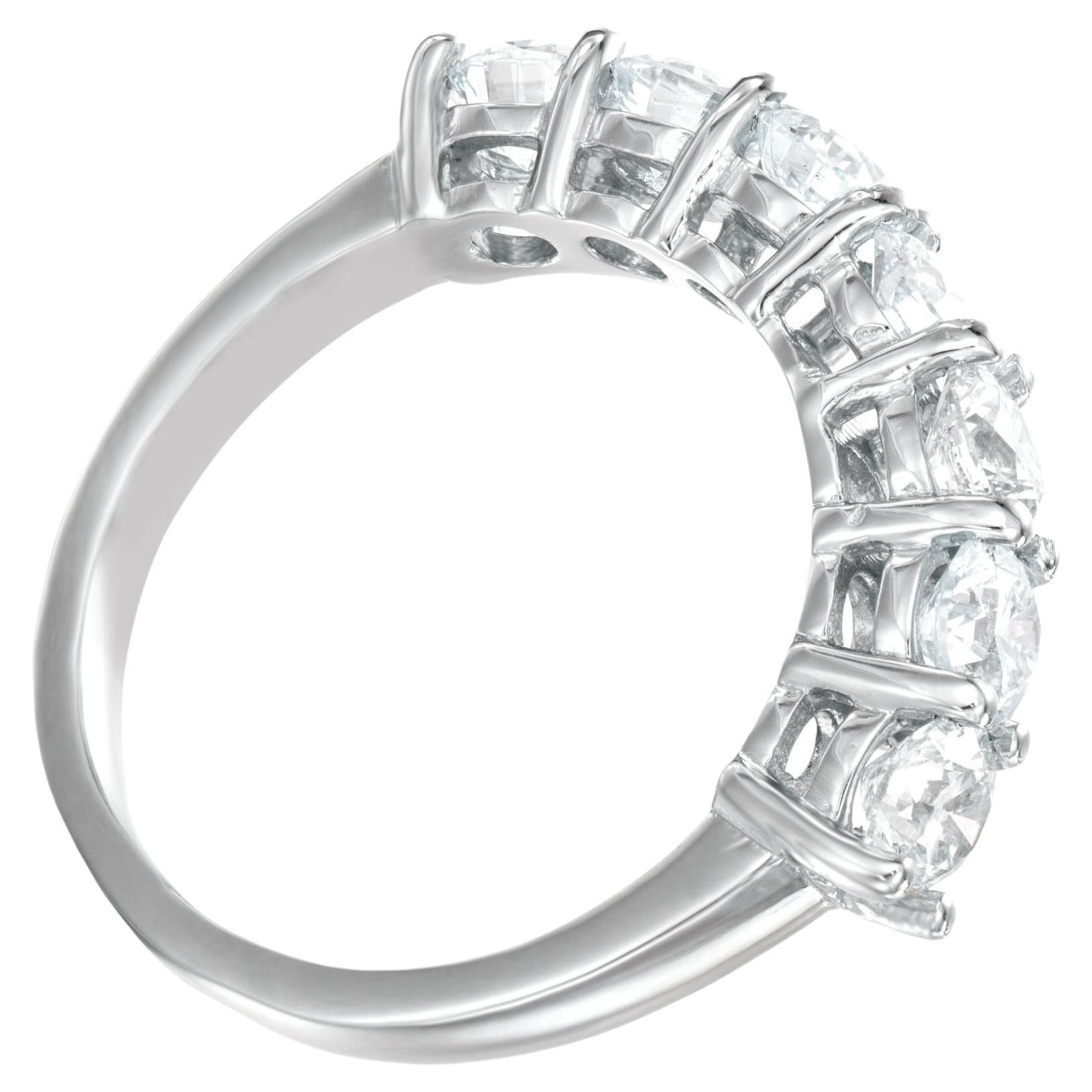 This stunning half eternity band is crafted in solid 18K white gold; features 7 diamonds graded in F-G color and VS in clarity.
The total carat weighs is 1.80
The ring is resizable upon request.
