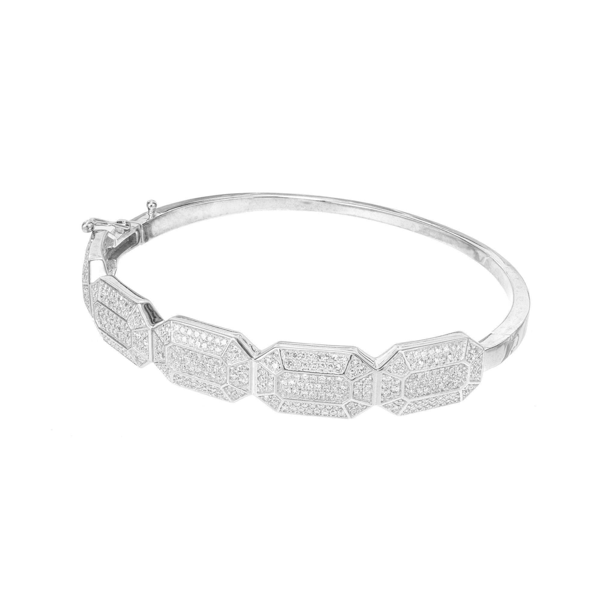 Art Deco Inspired diamond bangle bracelet. This 14k white gold bangle bracelet is set with 370 pave set diamonds, in five octagonal geometric sections. Fits a 7 -7.5 wrist 

370 single cut diamonds, G SI approx. 1.80cts
14k white gold
Stamped: