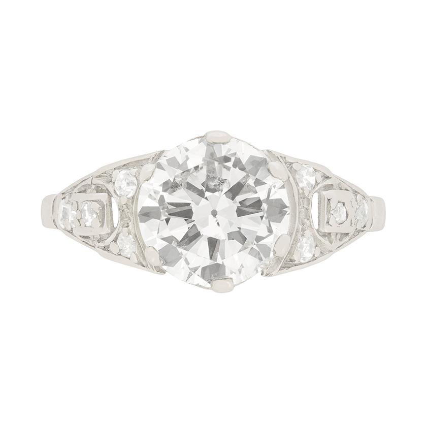 In our London shop, a wonderful example of a Art Deco era platinum and diamond engagement ring dating circa 1930s.

This Art Deco engagement ring centres a 1.80 carat transitional cut diamond claw set in a platinum mounting, adorned at the shoulders