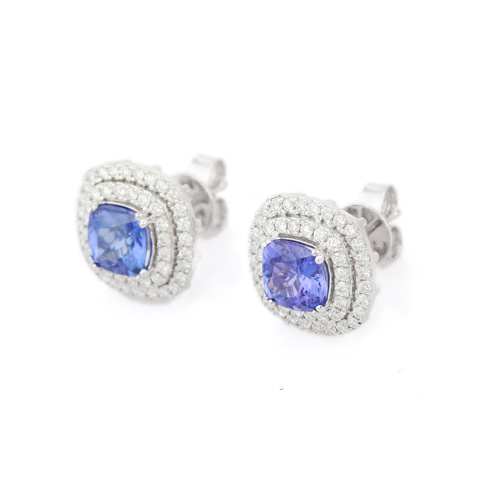 Studs create a subtle beauty while showcasing the colors of the natural precious gemstones and illuminating diamonds making a statement.

Cushion cut tanzanite studs with diamonds in 18K white gold. Embrace your look with these stunning pair of