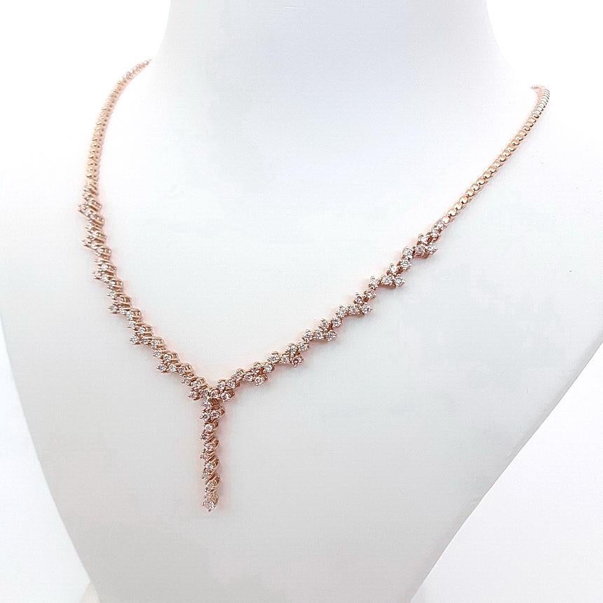 This mesmerizing 14kt. pink gold necklace illuminates pure class and elegance with its unique design which features 82 round brilliant natural pink diamonds totaling 1.80 carats. This gorgeous necklace will be a perfect match for your evening dress.