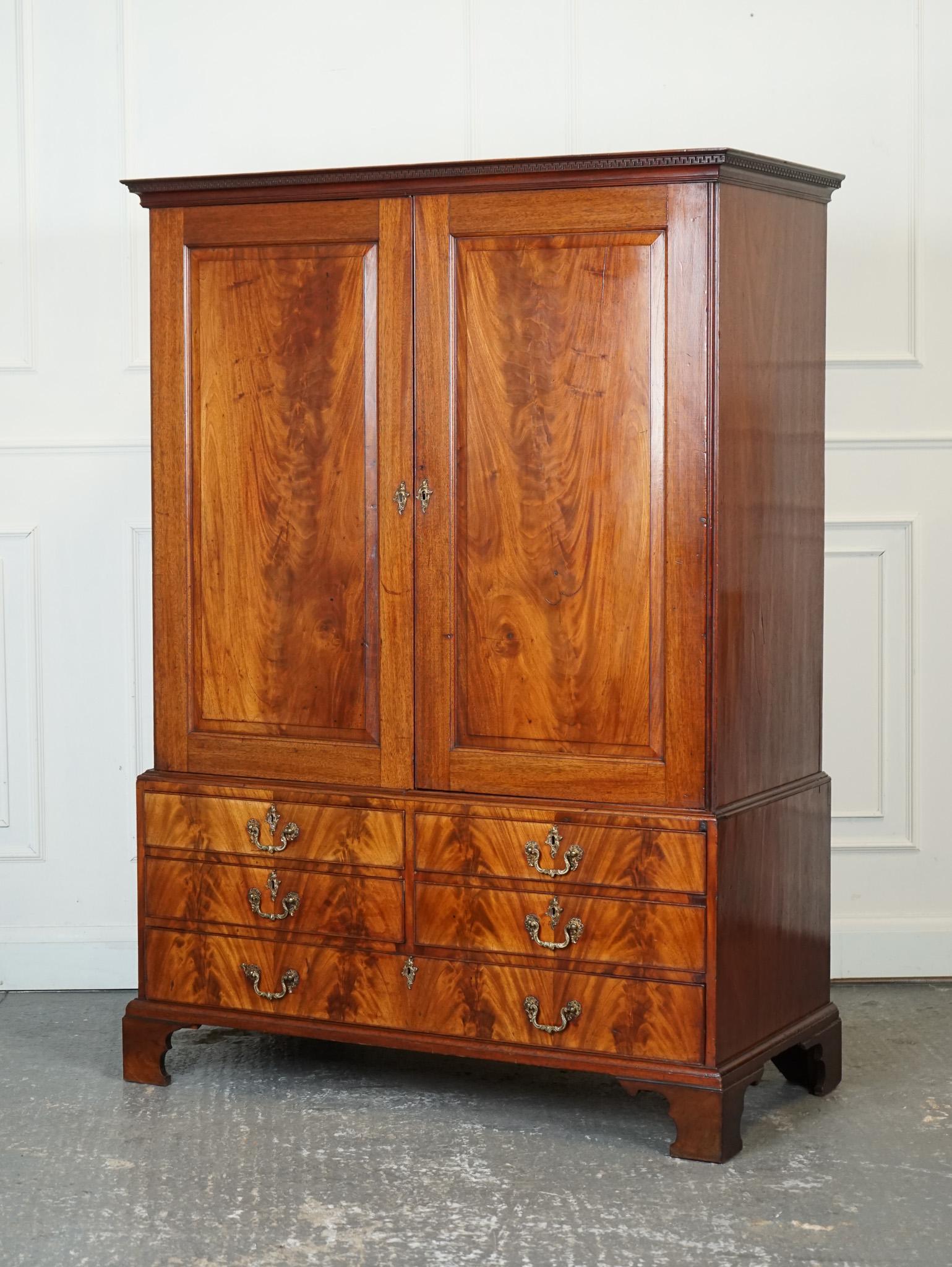 

We are delighted to offer for sale this 1800 Antique Georgian Linen Press Wardrobe.

The 1800 Antique English Georgian Flamed Hardwood Linen Press Wardrobe Armoire is a luxurious and elegant piece of furniture with a rich history and exquisite