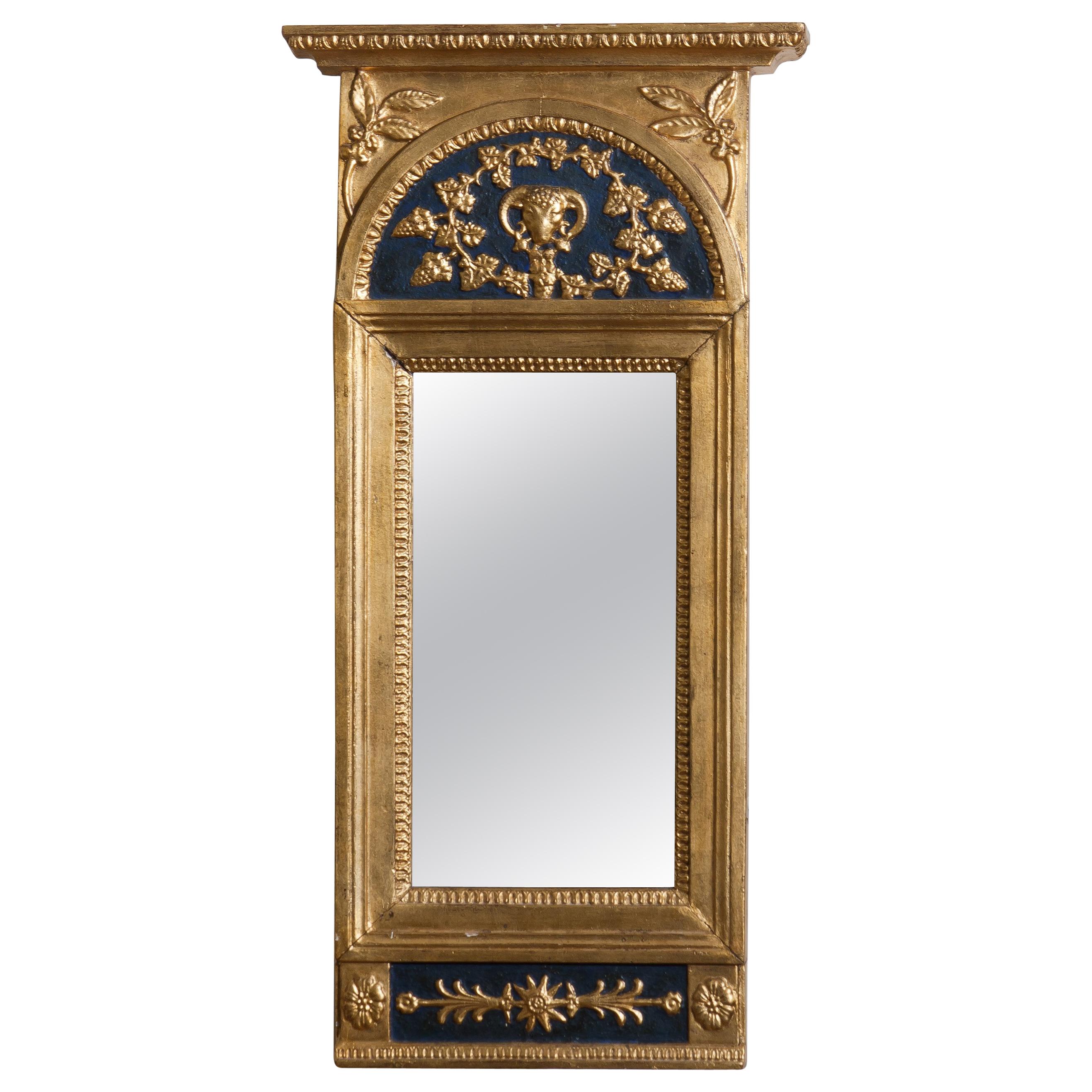 Gilded or panted Empire mirror, first half of the 1800s.
The mirror is in a later period restored and partly newly painted.
Overall condition is good. 
 