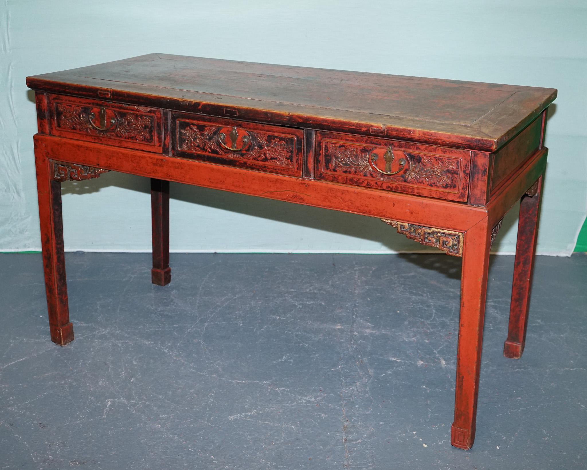 Antiques of London

This late Qing Dynasty console table (circa 1880–1910) exemplifies the artistry and craftsmanship of late imperial China. The piece is finished in a deep red lacquer, which has developed a rich, naturally aged patina, adding