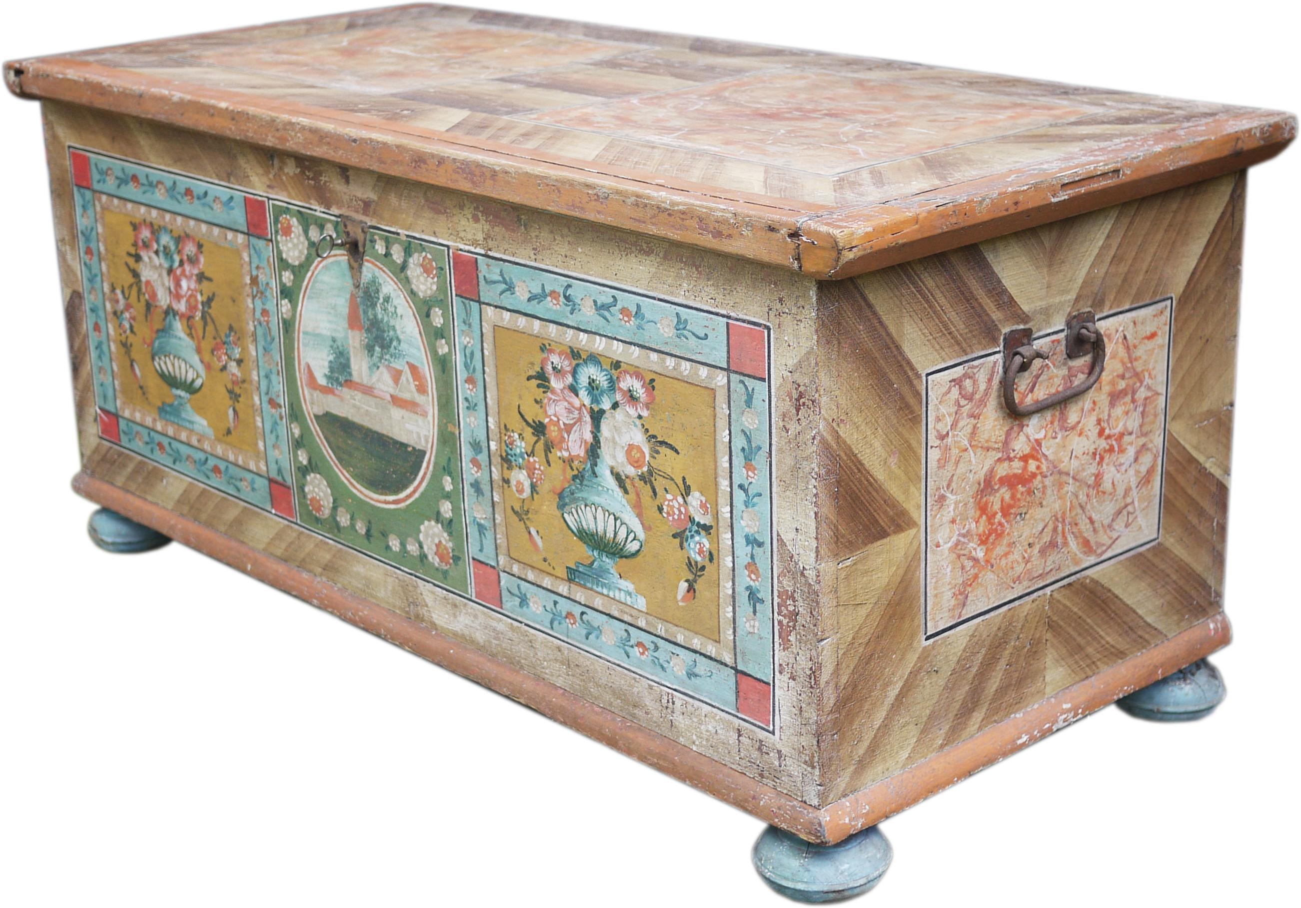 Measures: 
H.64, L. 144, P. 66
H. 25.2 in, W. 56.7 in, D. 26 in

Antique painted chest, partially restored. The background is decorated in faux wood, reproducing a herringbone pattern in four stages. On the front two side panels contain rich