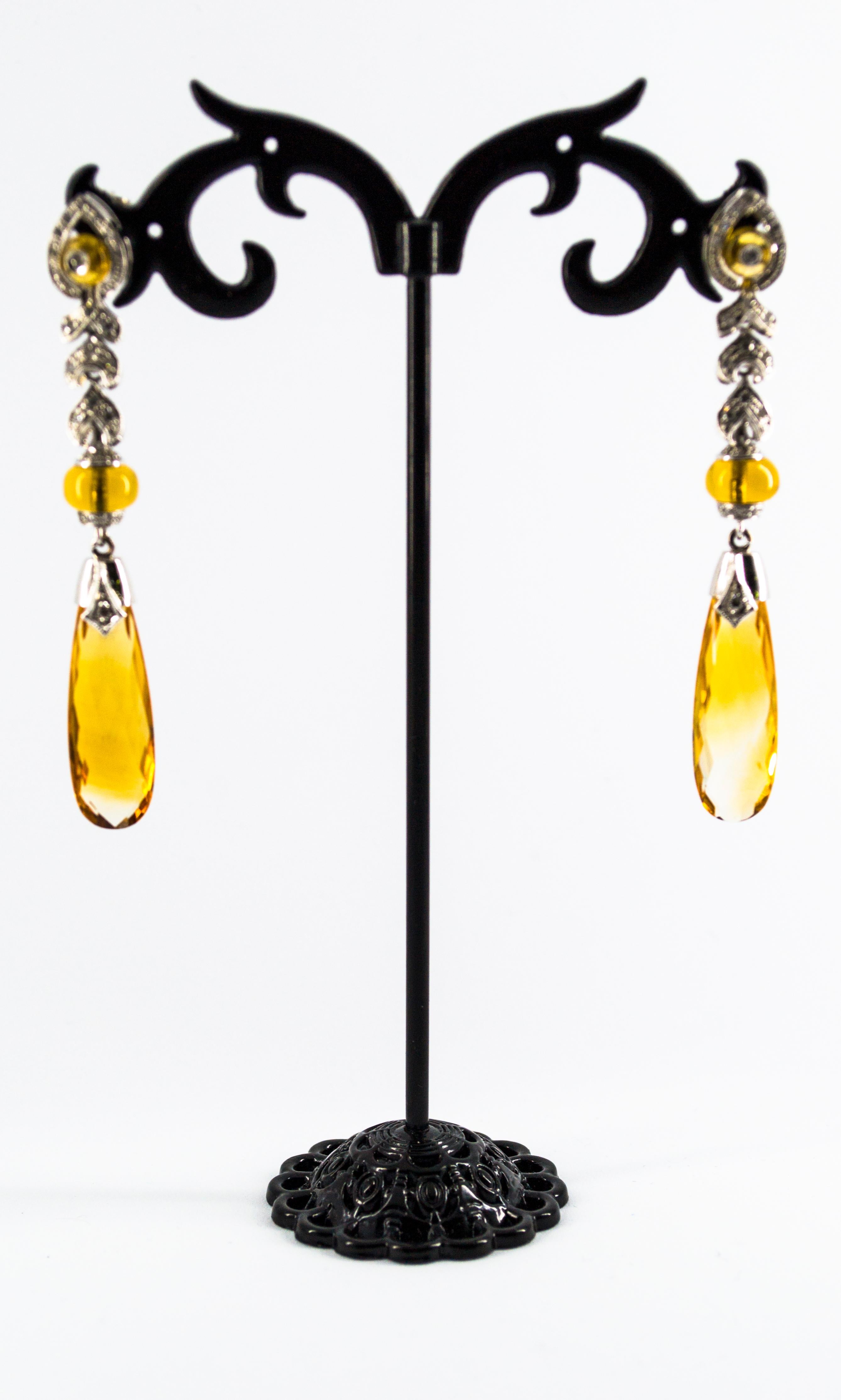 These Earrings are made of 9K White Gold.
These Earrings have 0.30 Carats of White Diamonds.
These Earrings have 18.00 Carats of Citrine.
All our Earrings have pins for pierced ears but we can change the closure and make any of our Earrings suitable