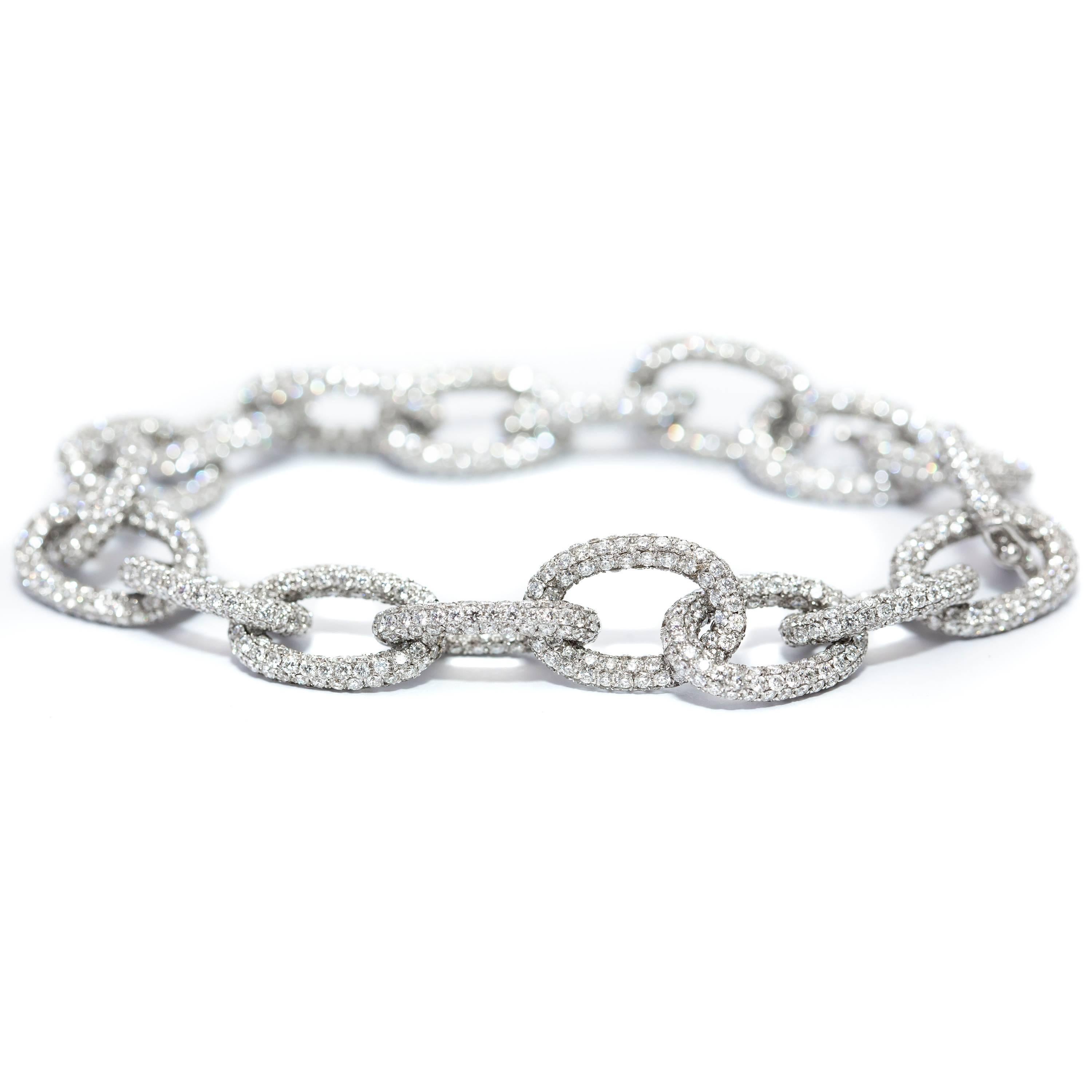 This Beautiful 18.00 Carat Round Diamond white Color G Clarity VS1 Pave Set Diamond chain bracelet set in 18 Karat White Gold. A statement piece that sparkles and stands out like none other. British Hallmarked. 