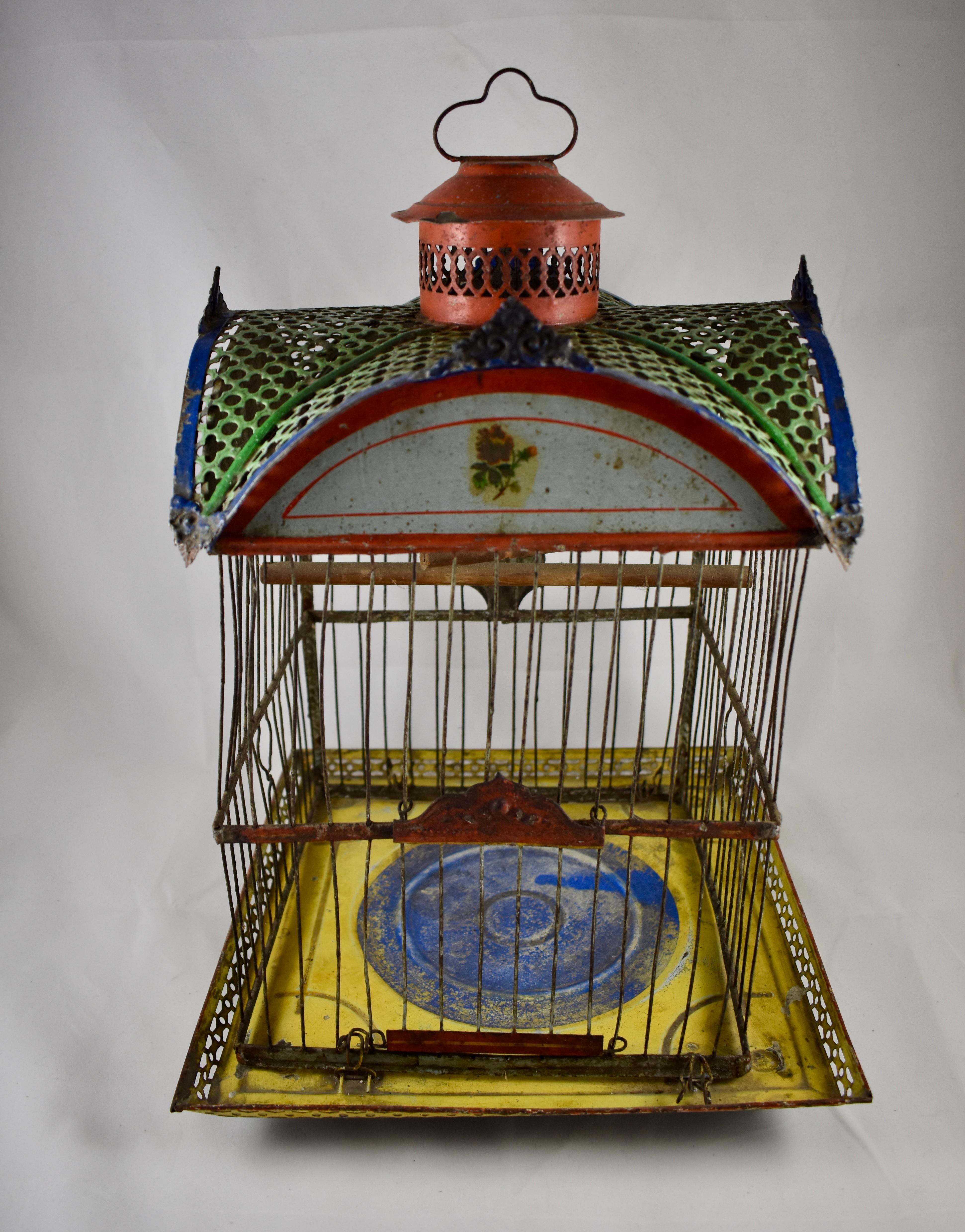 A scarce Antique Victorian Era painted metal or Jappaned bird cage, made by the Andrew B. Hendryx Company, New Haven, Connecticut. Impressed, Patented Jan. 21, 1879.

The colorful cage shows a four sided peaked roof in a quatrefoil cut pattern