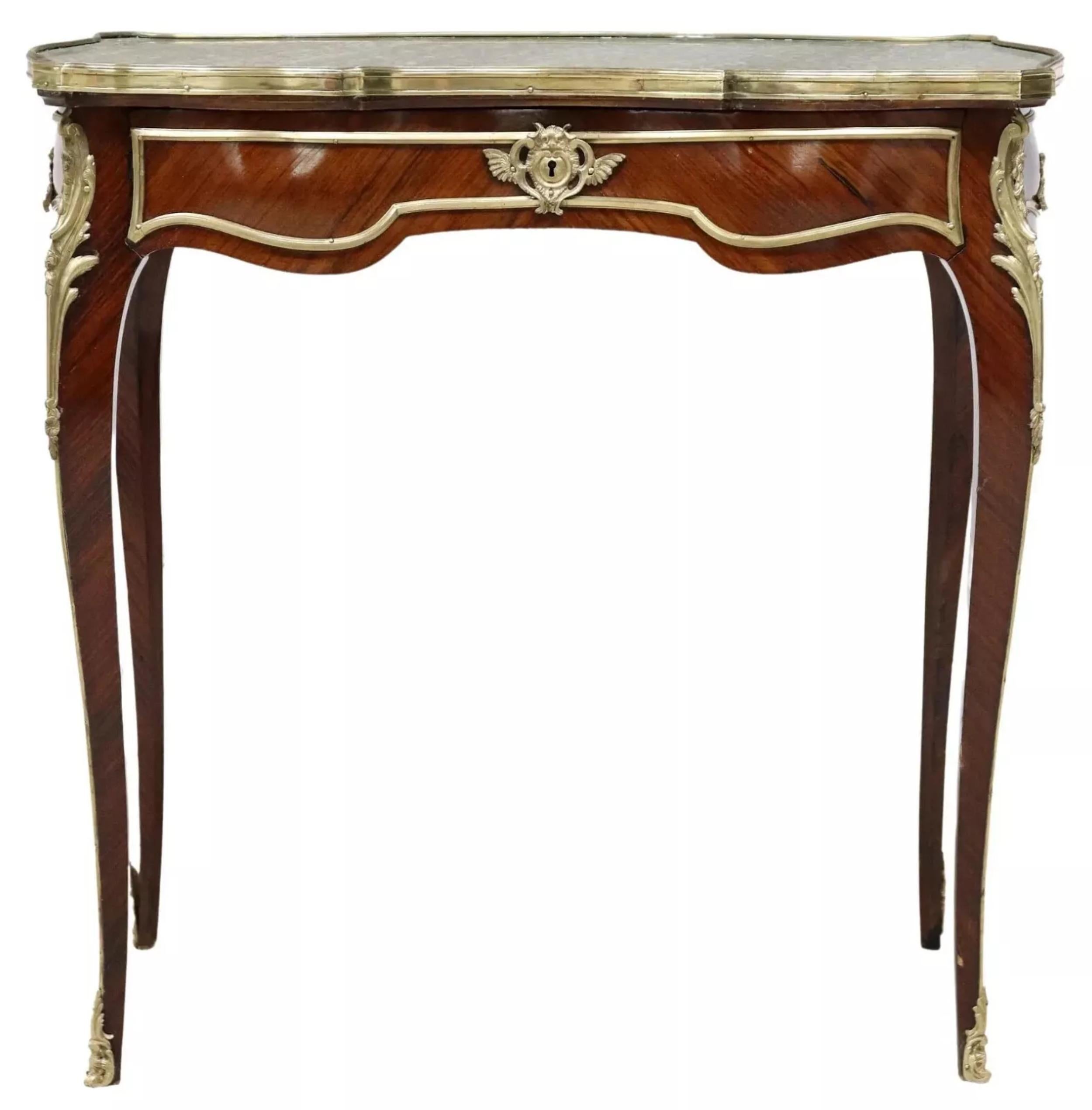 Gorgeous Antique Table, French Louis XV Style, Marble-Top, Gilt Metal Accents, 1800s, 19th Century!

This antique table boasts a luxurious Louis XV style with a rectangular marble top and gilt metal mounts. The table features a unique cabriolet leg