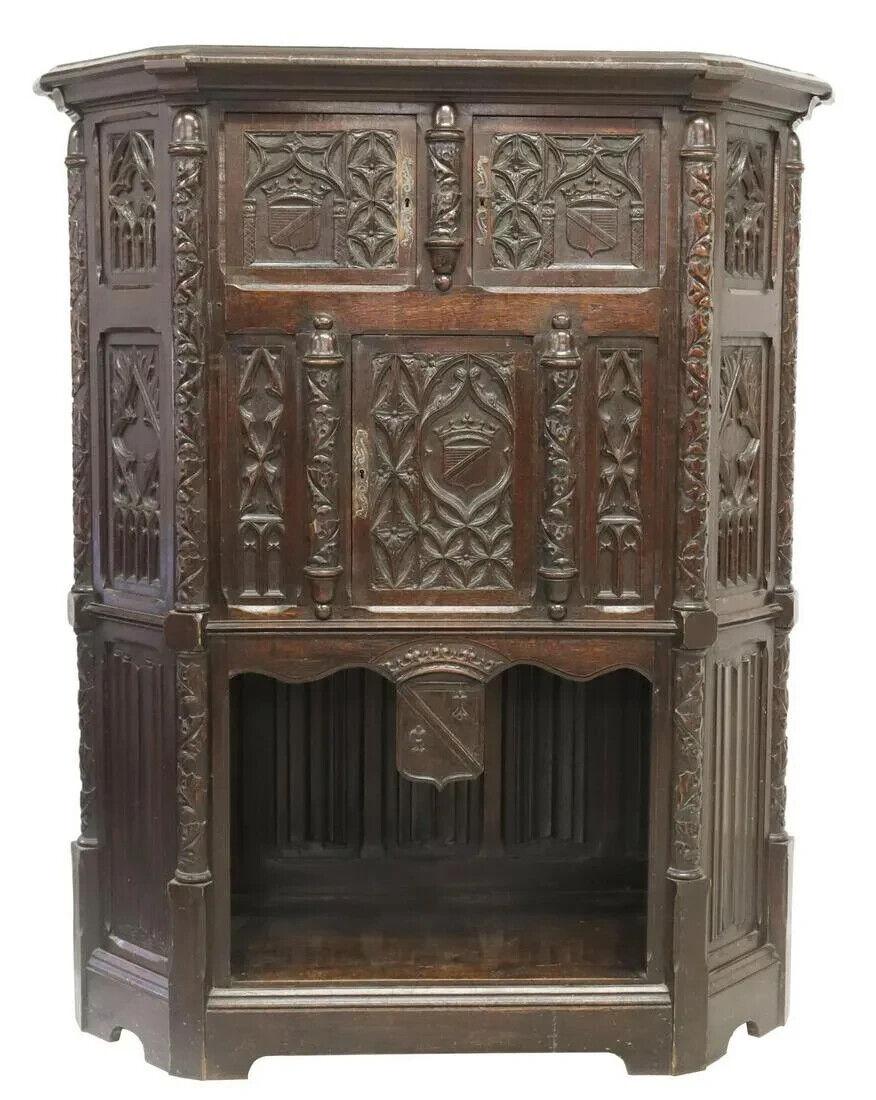 Stunning antique cupboard, gothic revival, carved oak, credence, foliates, 1800s, 19th century!!

Gothic Revival oak credence cupboard, 19th century, canted case, carved with tracery and foliates throughout, having two small top cabinets, over