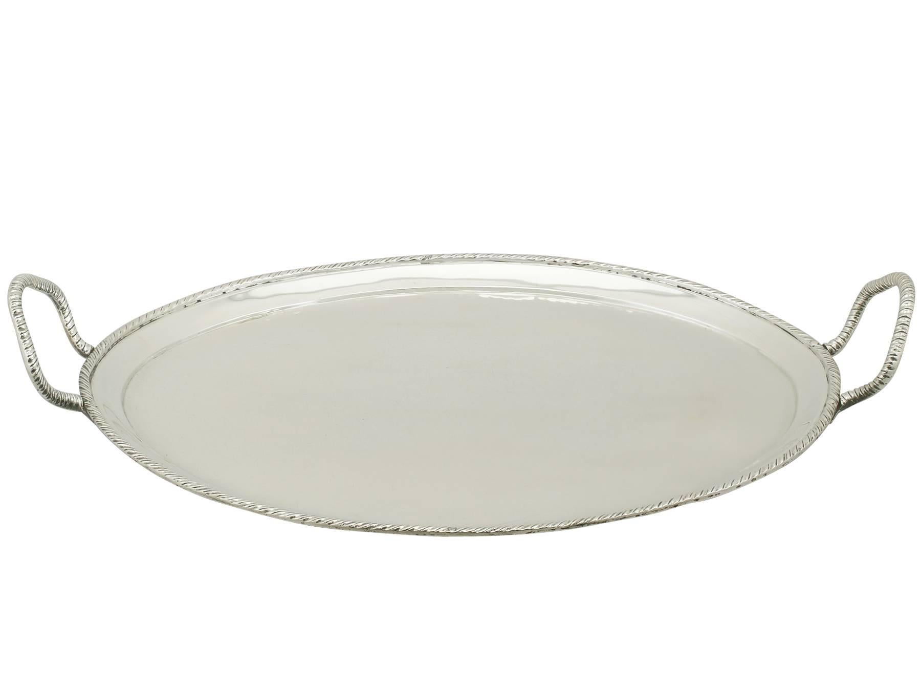 A fine and impressive antique Italian silver two handled tray; an addition to our continental silver collection.

This impressive antique Italian silver tray has a plain oval form.

The surface of this Italian tray is plain and