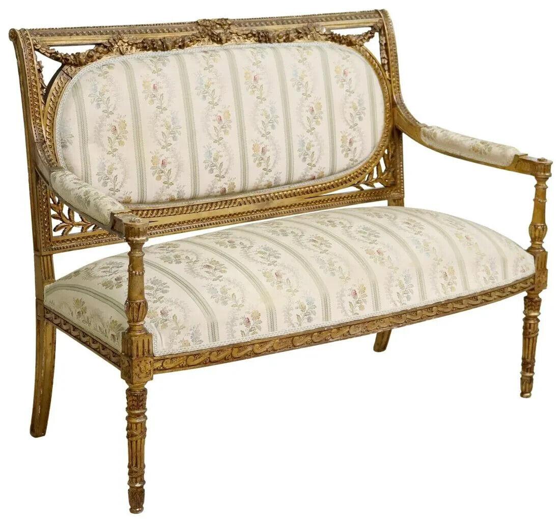 Charming Antique Sofa, Louis XVI Style Floral Upholstered, Gilt, Crest, Molded Back, 1800s, 19th century!!

Louis XVI style gilt painted sofa, late 19th c., having ribbon crest, over molded back with floral swag, padded back and seat in patterned