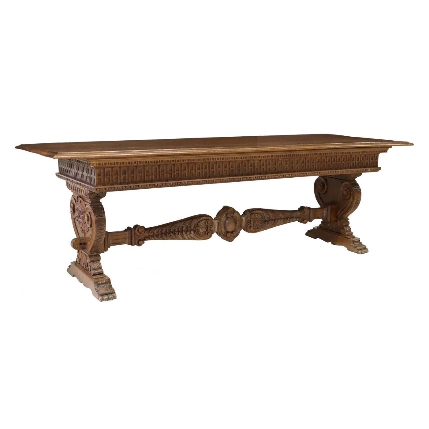 Gorgeous 1800s Antique Monumental Renaissance Revival Walnut, Volute Support Table!!

Italian Renaissance Revival walnut table, 19th c., rectangular top, molded apron, volute supports with carved grotesque masks, cross stretcher with wedged mortise