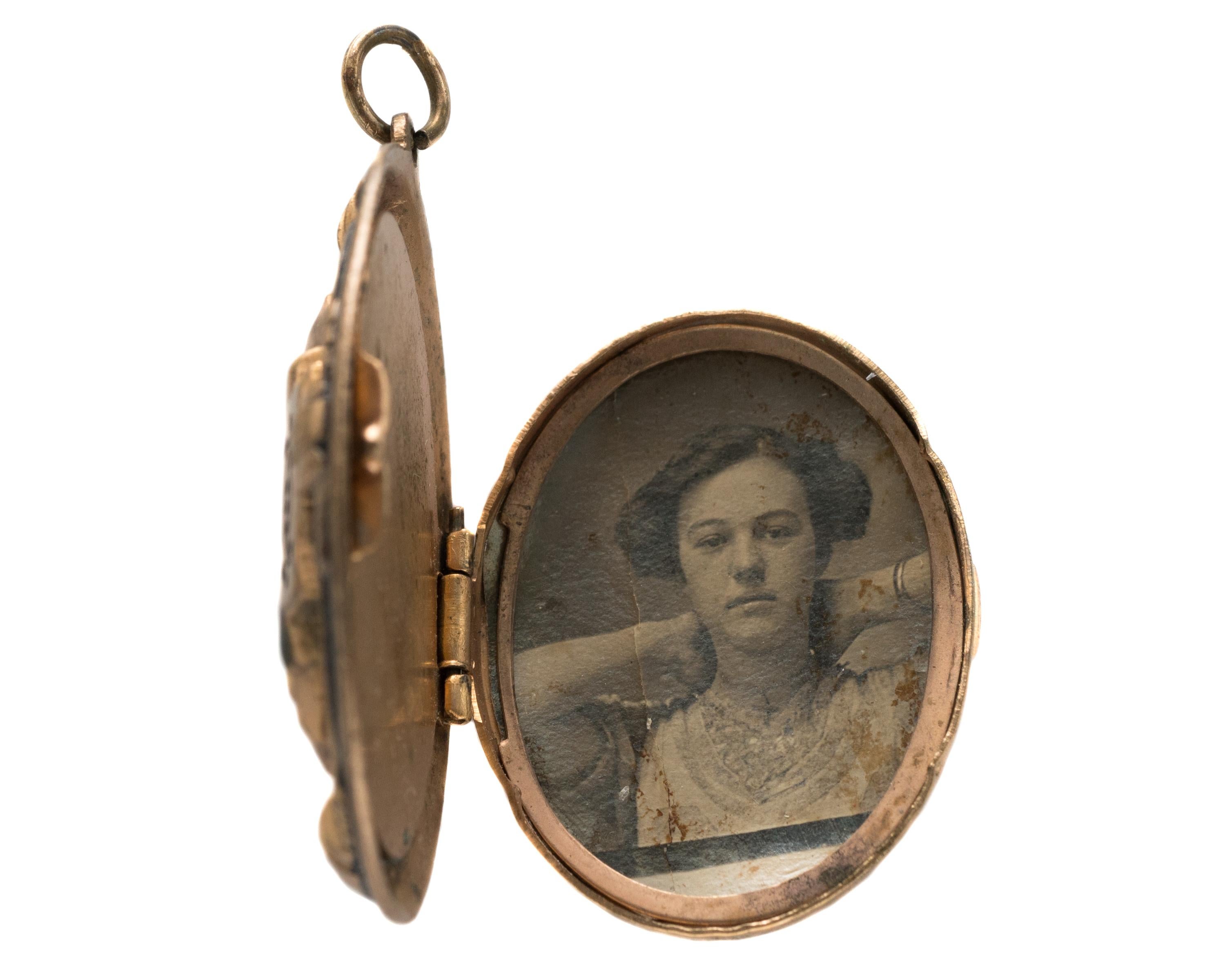 Antique Victorian Locket - 10 Karat Yellow Gold

Features: 
Intricately Detailed Design on front
Hinged and Opens
Portrait of a Young Woman inside
Snaps closed
Measures 1.5 x 1.25 inches, 8.5 millimeter thick

Locket Details:
Measures 1.5 x 1.25