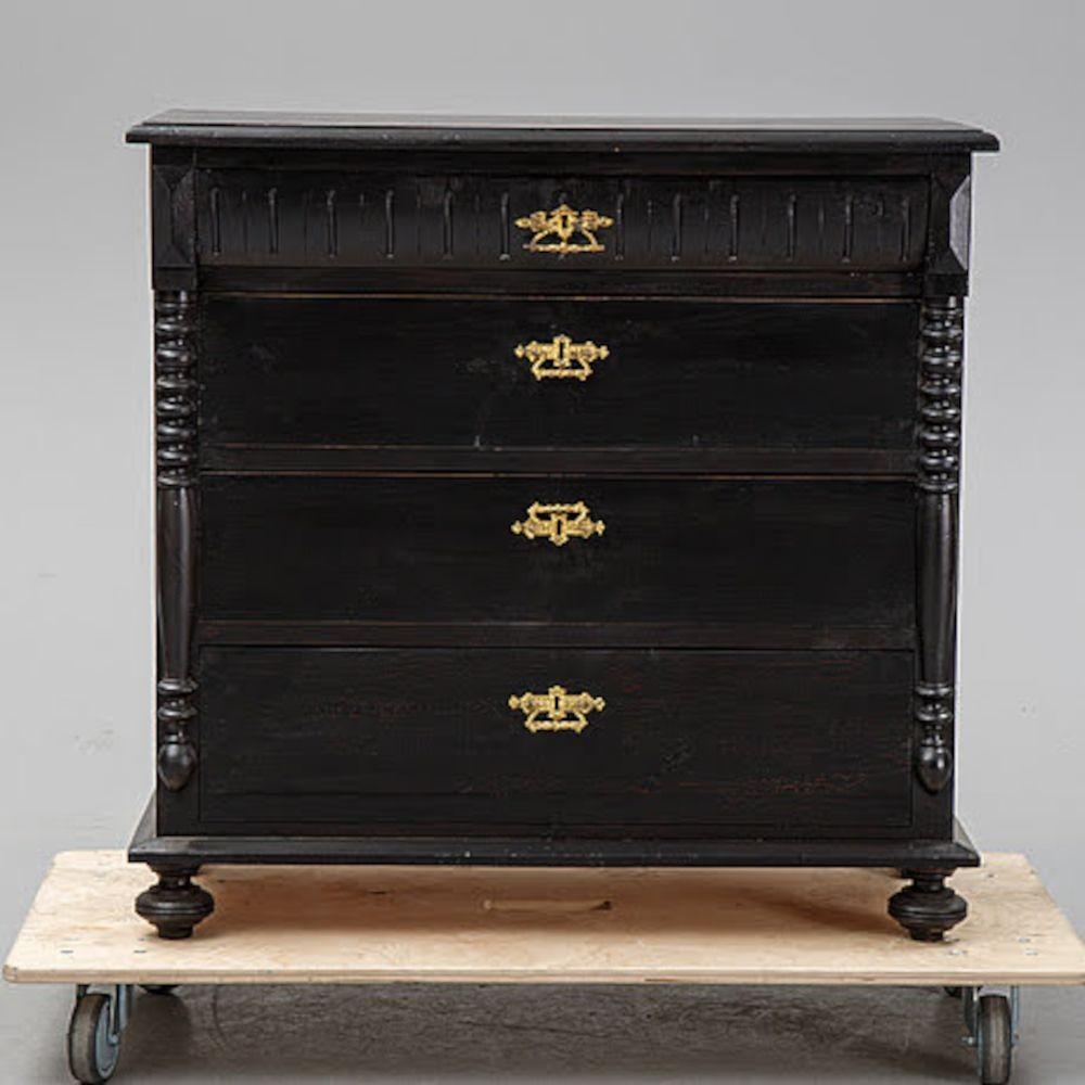 1800s black painted bureau. Four drawers, classic carved details, brass hardware, decorative bun feet. Later painted.
 
H 36.25