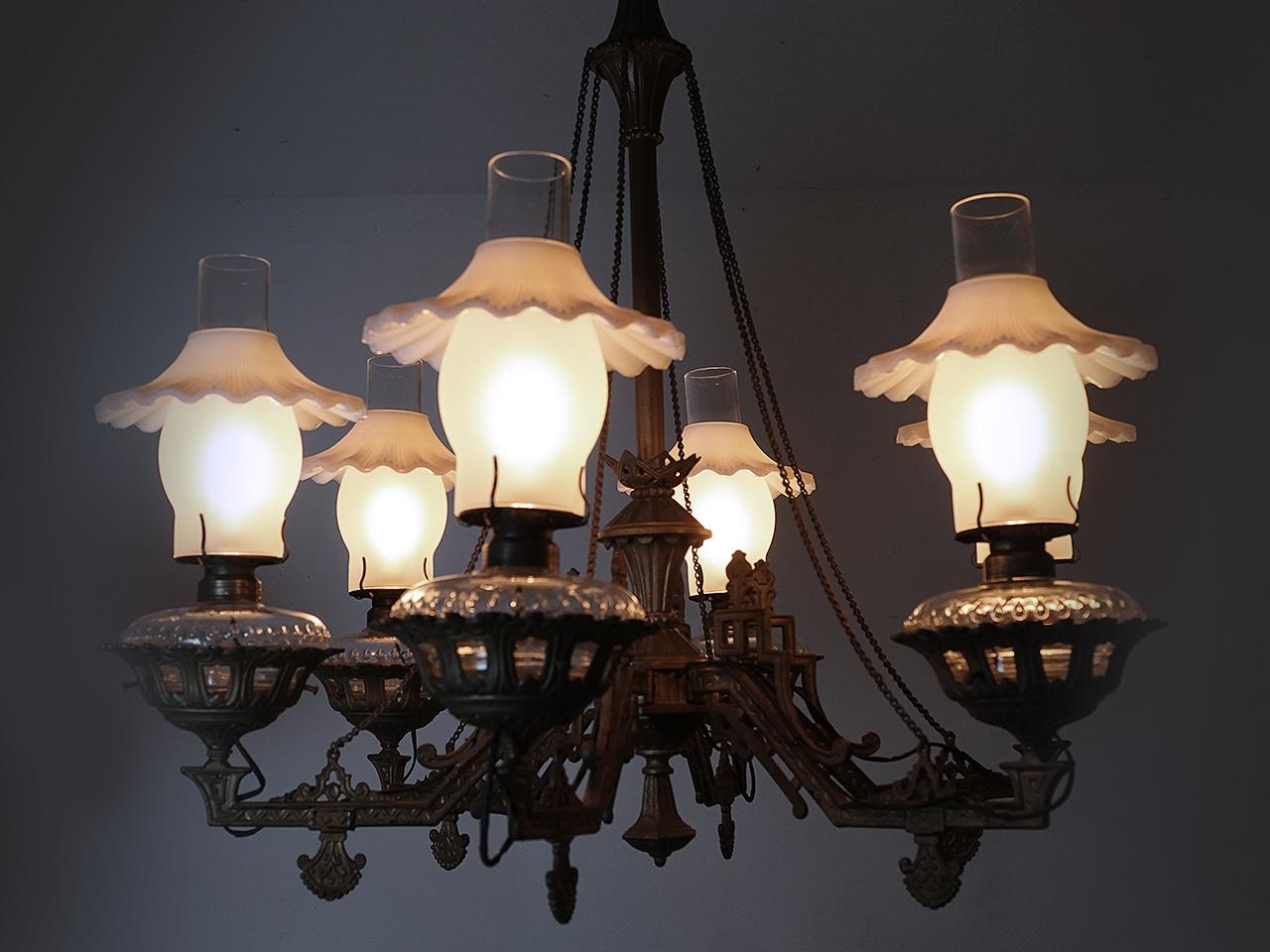 Not many of these large and impressive Eastlake oil chandeliers were made and few survive today. Lamps like this are often unsigned but are attributed to companies like Tucker or Bradley and Hubbard. Our best guess is 1870 by Tucker. There are six