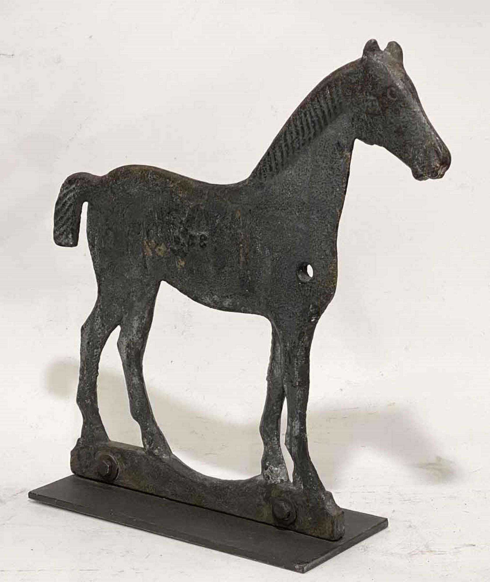 This is an antique cast iron horse windmill weight from the Great Plains mounted on a replacement steel base plate, with old faded gray paint in very good condition. This can be seen at our 333 West 52nd St location in the Theater District West of