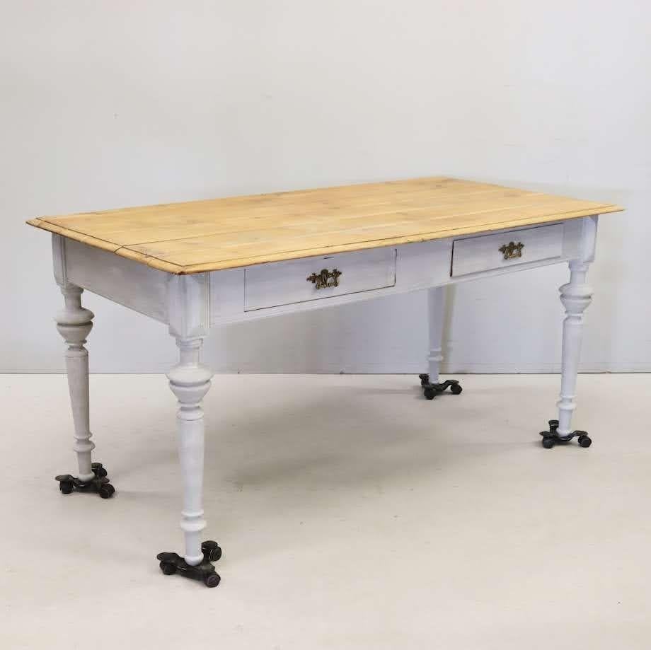 1800s dining table with pine top and whitewash painted legs. Swedish pine top with character to die for. Legs are carved simply with classic antique styling. Base of table has been whitewashed, most likely a later paint job. Brass hardware on the