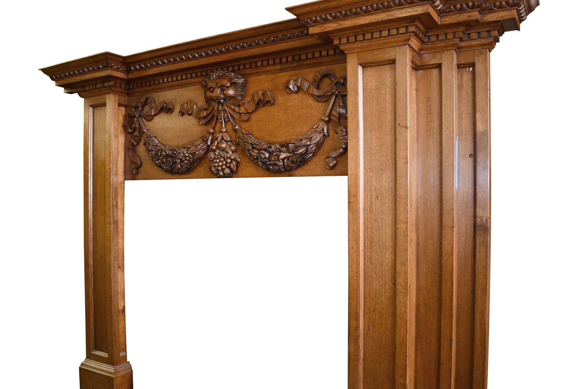1800s English Regency Style Carved Oak Tall Mantel with Lion, Ribbon and Swags In Good Condition For Sale In New York, NY