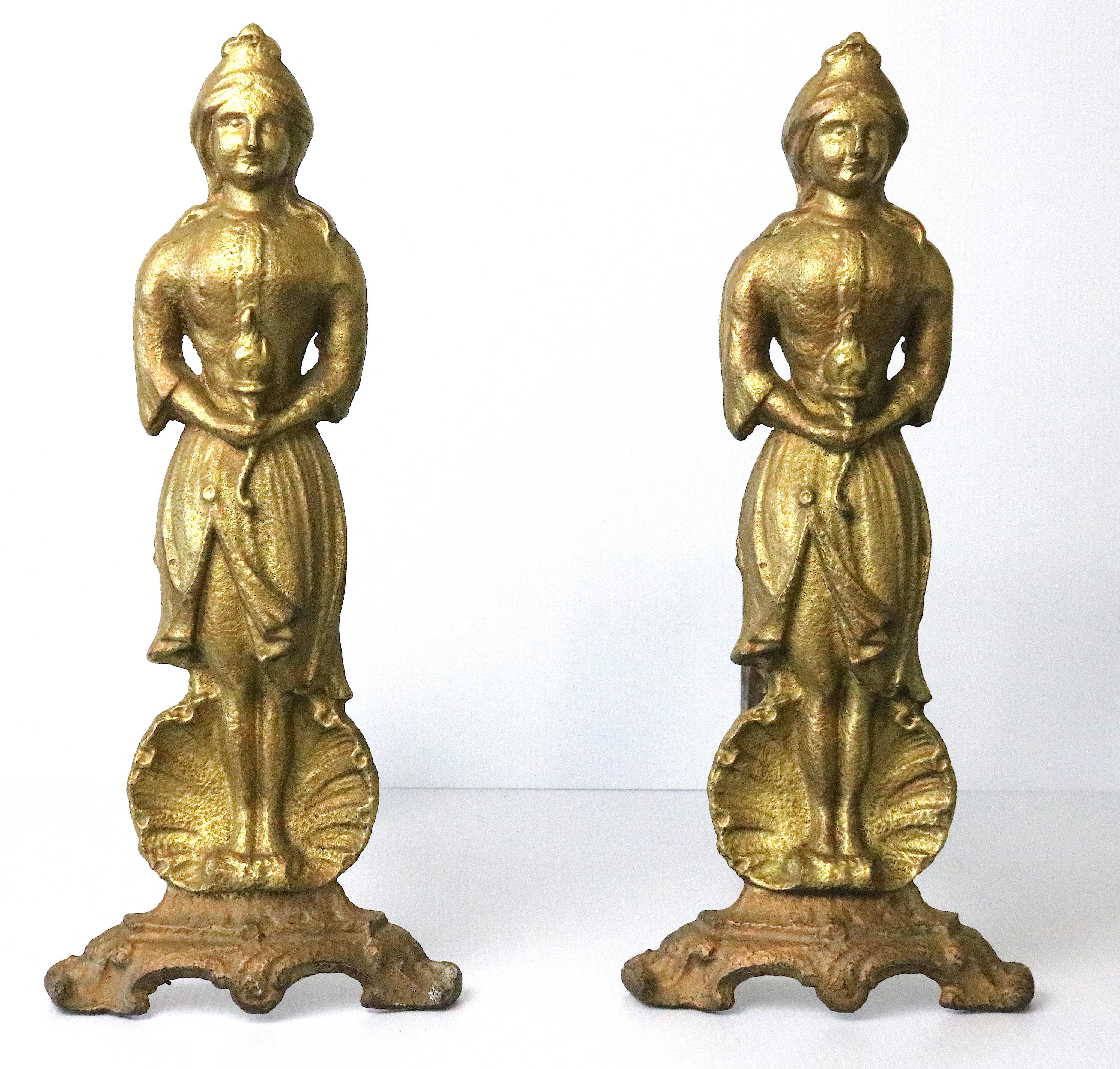 Distinctive figural Victorian andirons- antique Lady Liberty

This is an antique pair of gilt cast iron andirons in the form of the American Lady Liberty with the freedom torch in her hand and a nautilus shell behind her legs,
circa