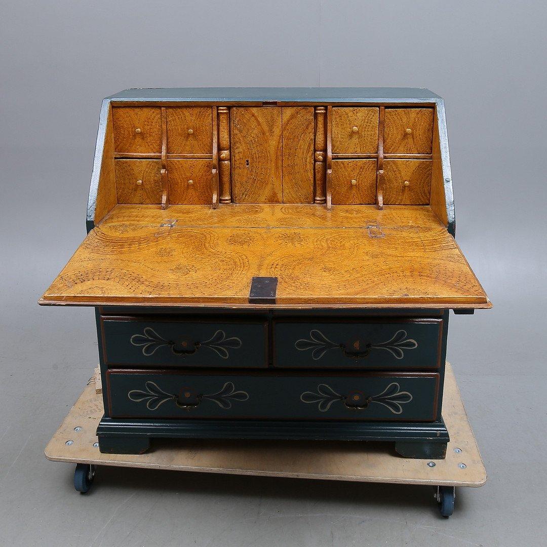 Add a little magic to your home with this hand painted, folklore secretary from the 1800s. Features slanted flap with drawer interior behind and five drawers. What's most fun about this piece, besides it's whimsical details and colors, is the