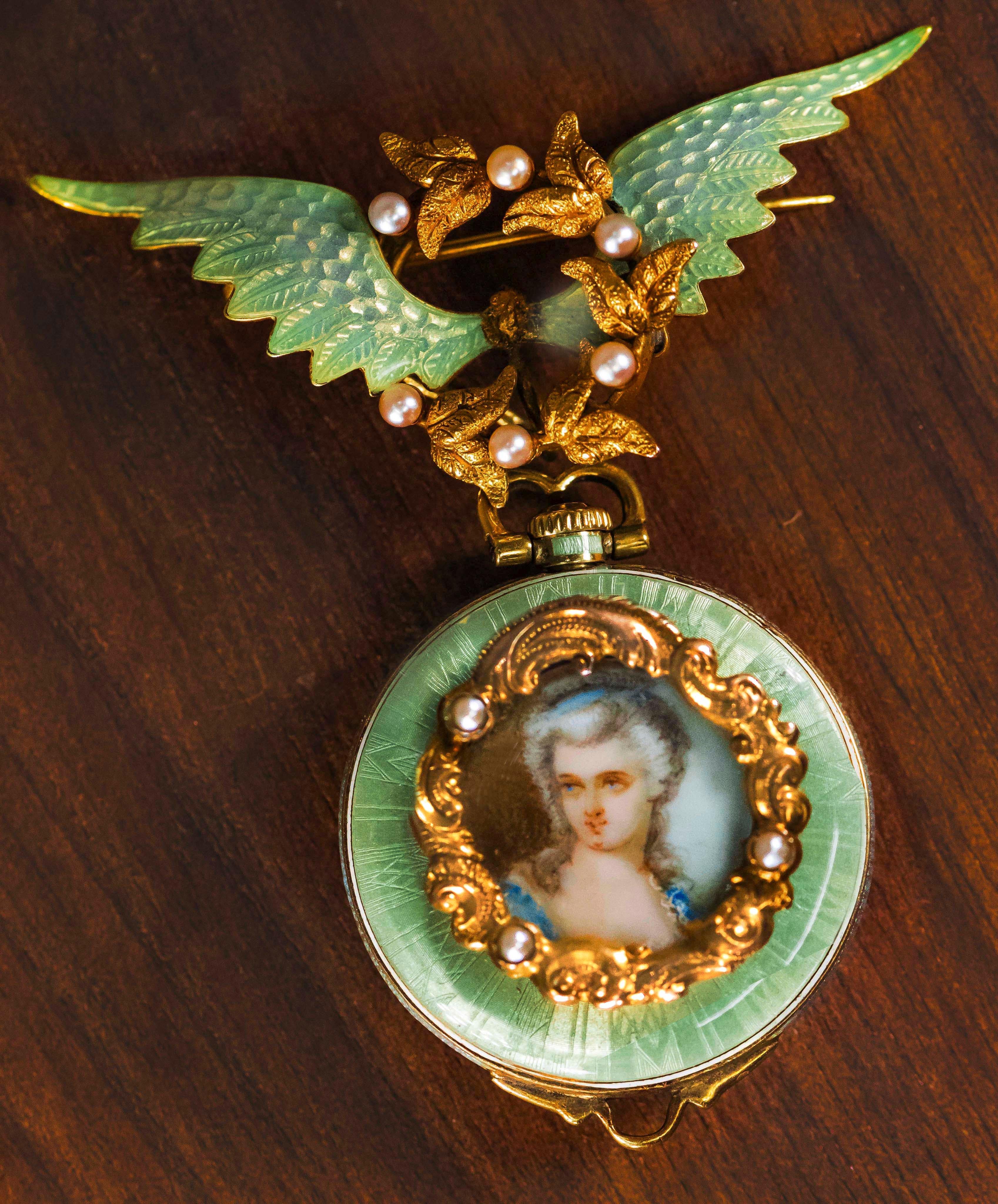 An Impressive & Extremely Well-Made Art Nouveau 1840s-1860s, Iridescent Enamel Angel Winged Pearl Set Flower Wreath Pendant Watch with matching
Blueish Green Enamel Portrait of French Bourgeois woman  

Basic Specifications & Special Features  