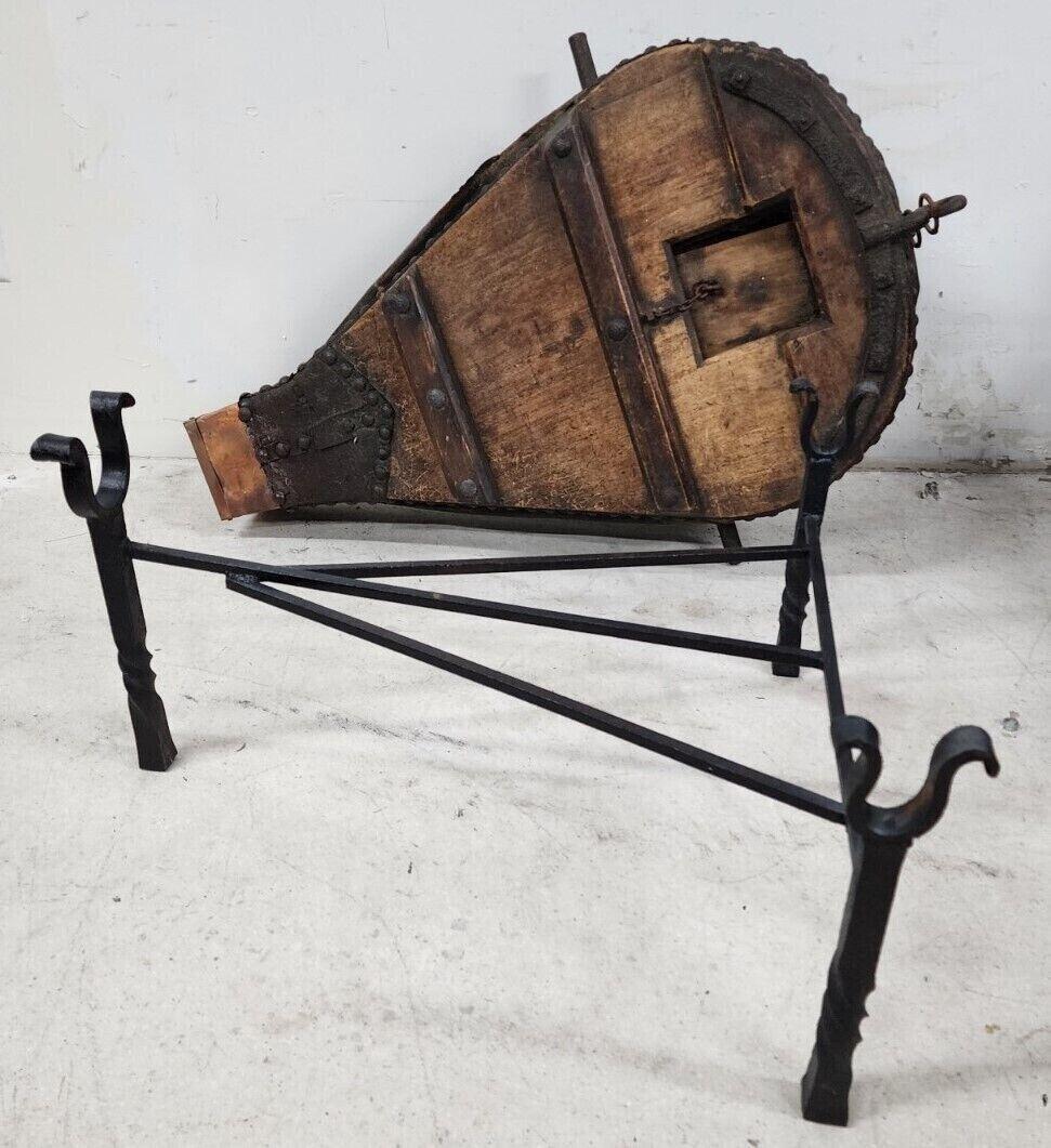 Offering One Of Our Recent Palm Beach Estate Fine Furniture Acquisitions Of A
1800s French Blacksmith Bellows Coffee Table
With a custom-made wrought iron stand capable of supporting a substantial glass top.
The top of the table is level for