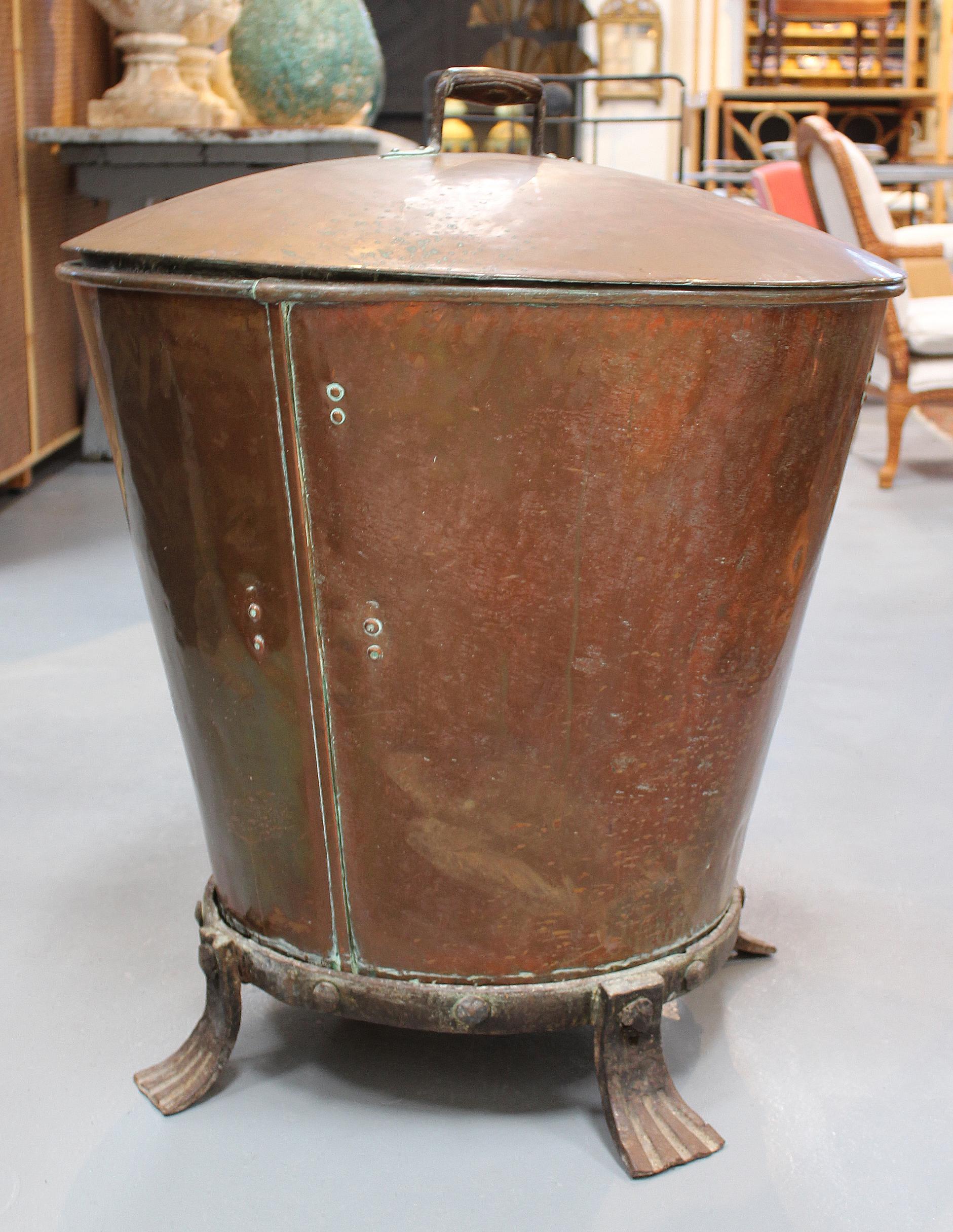 1800s French copper boiler with wrought iron base.