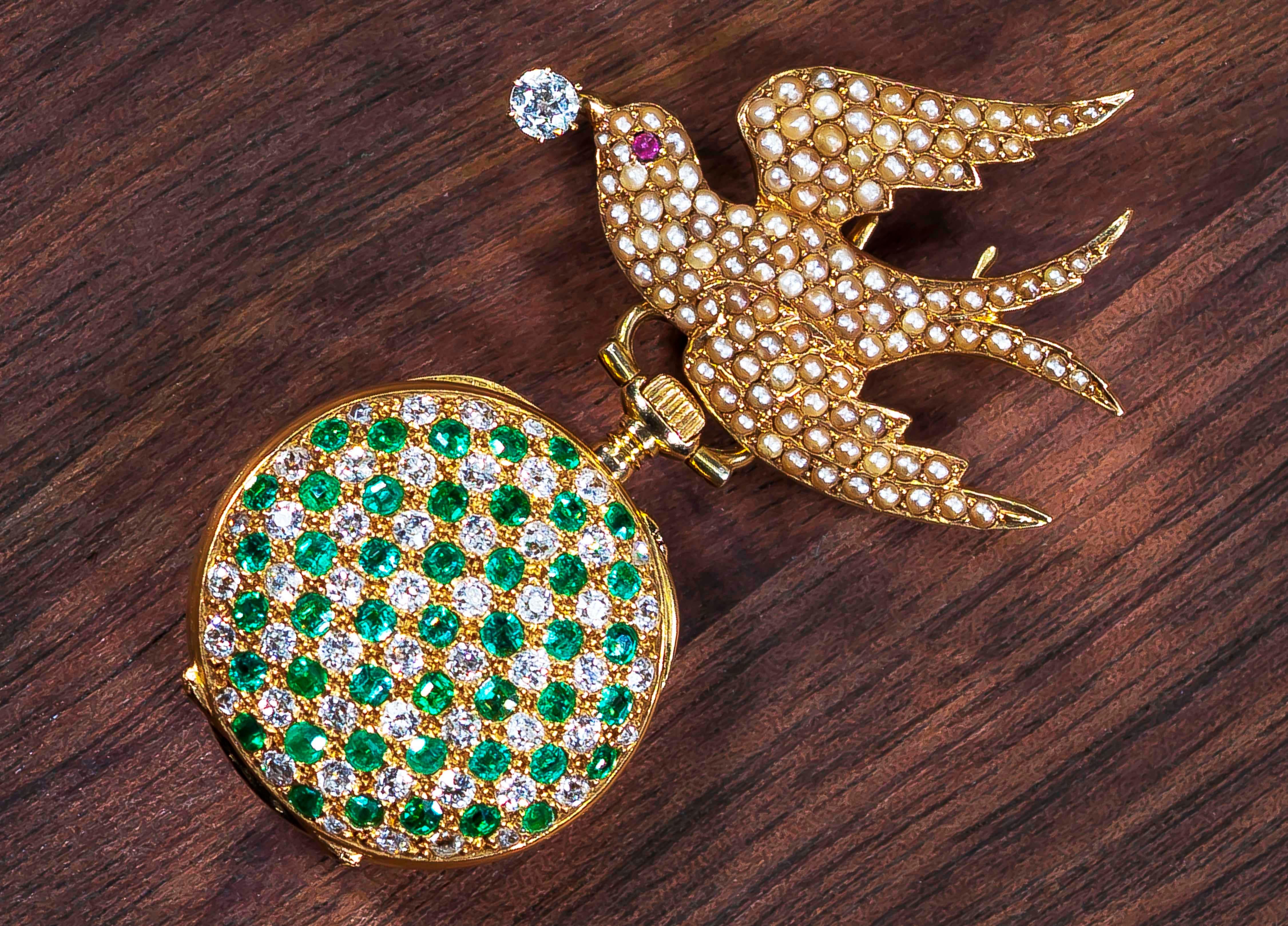 A Very Rare Signed Golay Fils & Stahl, Geneve, 18kt Yellow Gold, Pearl Set, Rose Cut Diamond, Ruby & Emerald Set ‘Swallow’ Lapel & Pendant Watch, Circa 1840-1880

Basic Specs & Overview
*Pendant Drop Dimensions: 75mm x 45mm 
(top of bird to bottom
