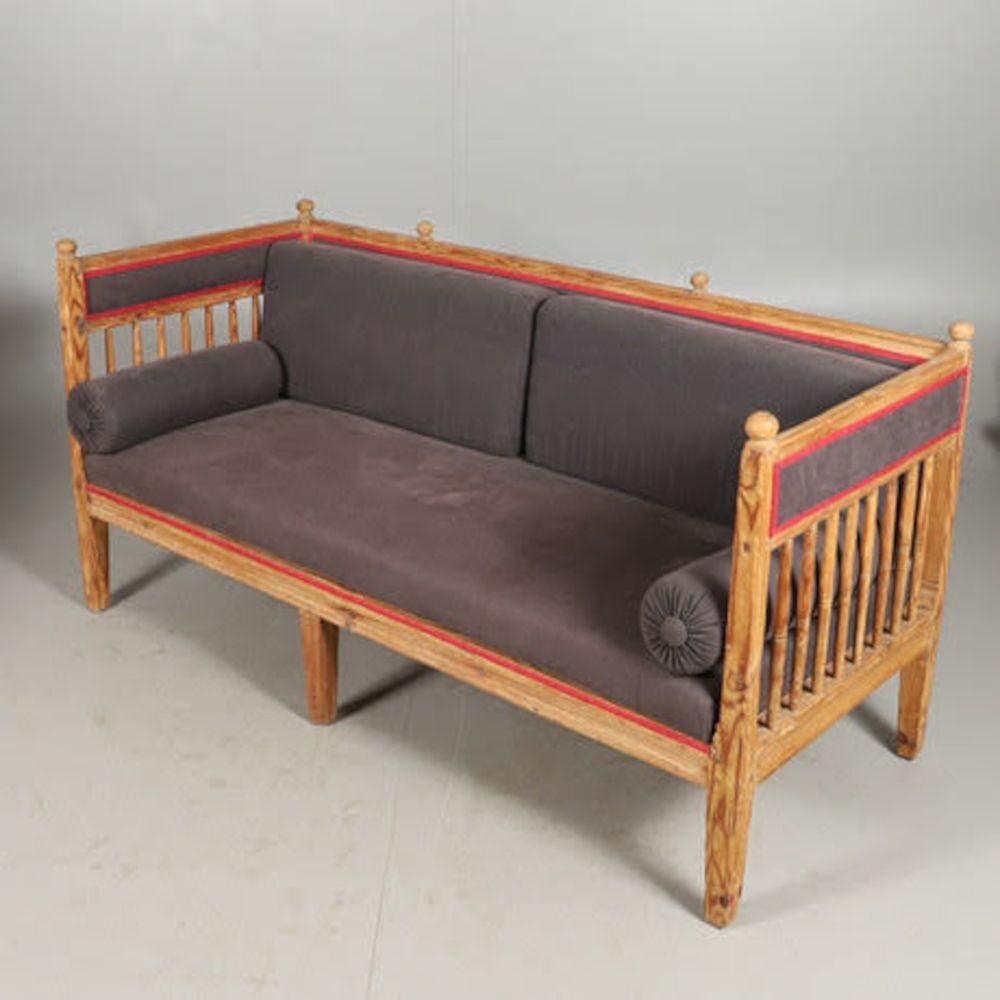 1800s Gustavian pine kitchen sofa daybed with grey upholstered seat with red trim. Late Gustavian gorgeous Swedish pine kitchen sofa daybed. Seat and seat back with later upholstery, grey with red trim and bolster pillows. The kitchen sofa is a
