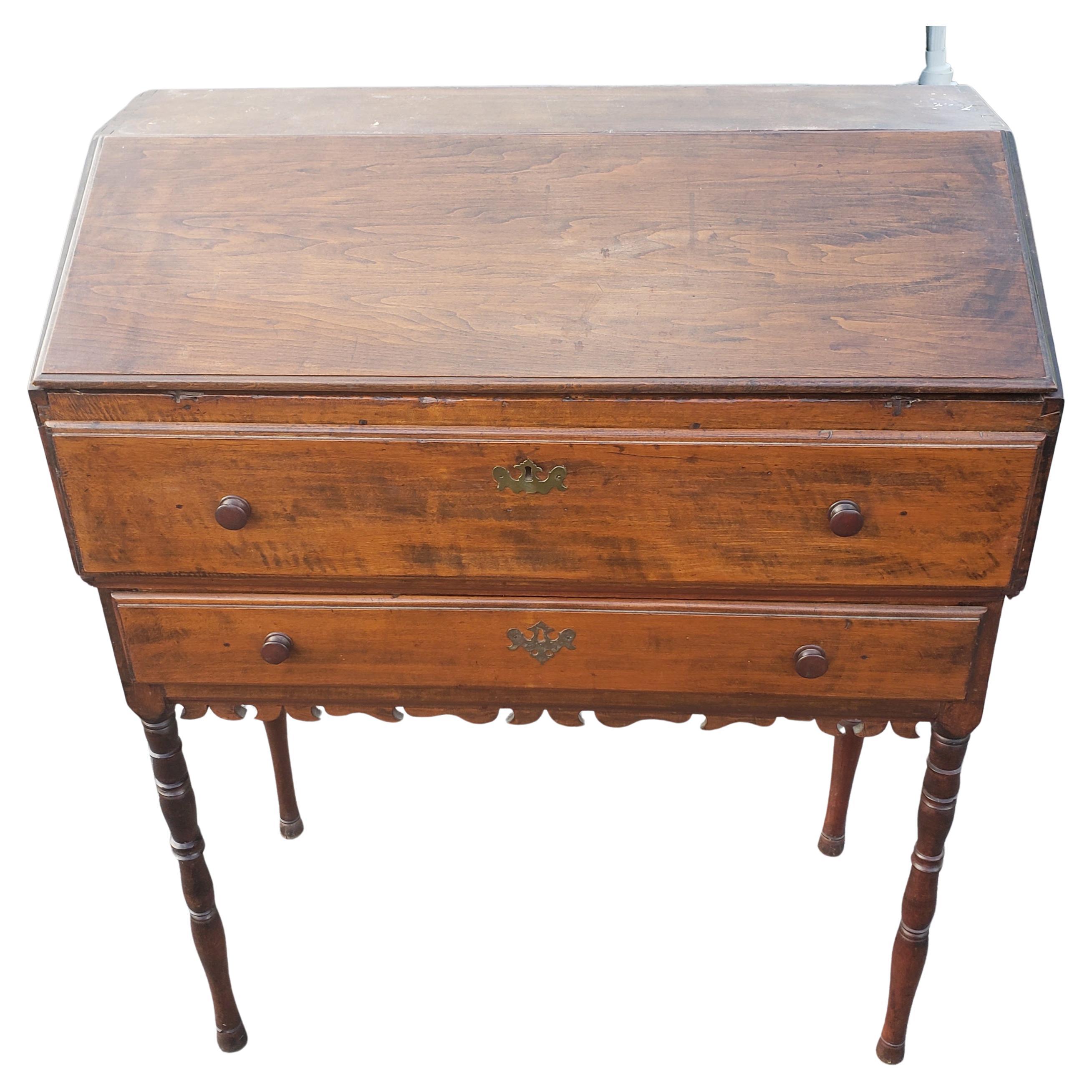 1800s Hancrafted tall slant top secretary desk. Wood appears to be flame maple. Solid dove tail joints. Turned legs and carved apron. Some wear appropriate with age and use. Lid is detached and appears to be by design. Was never hinged, but holds in