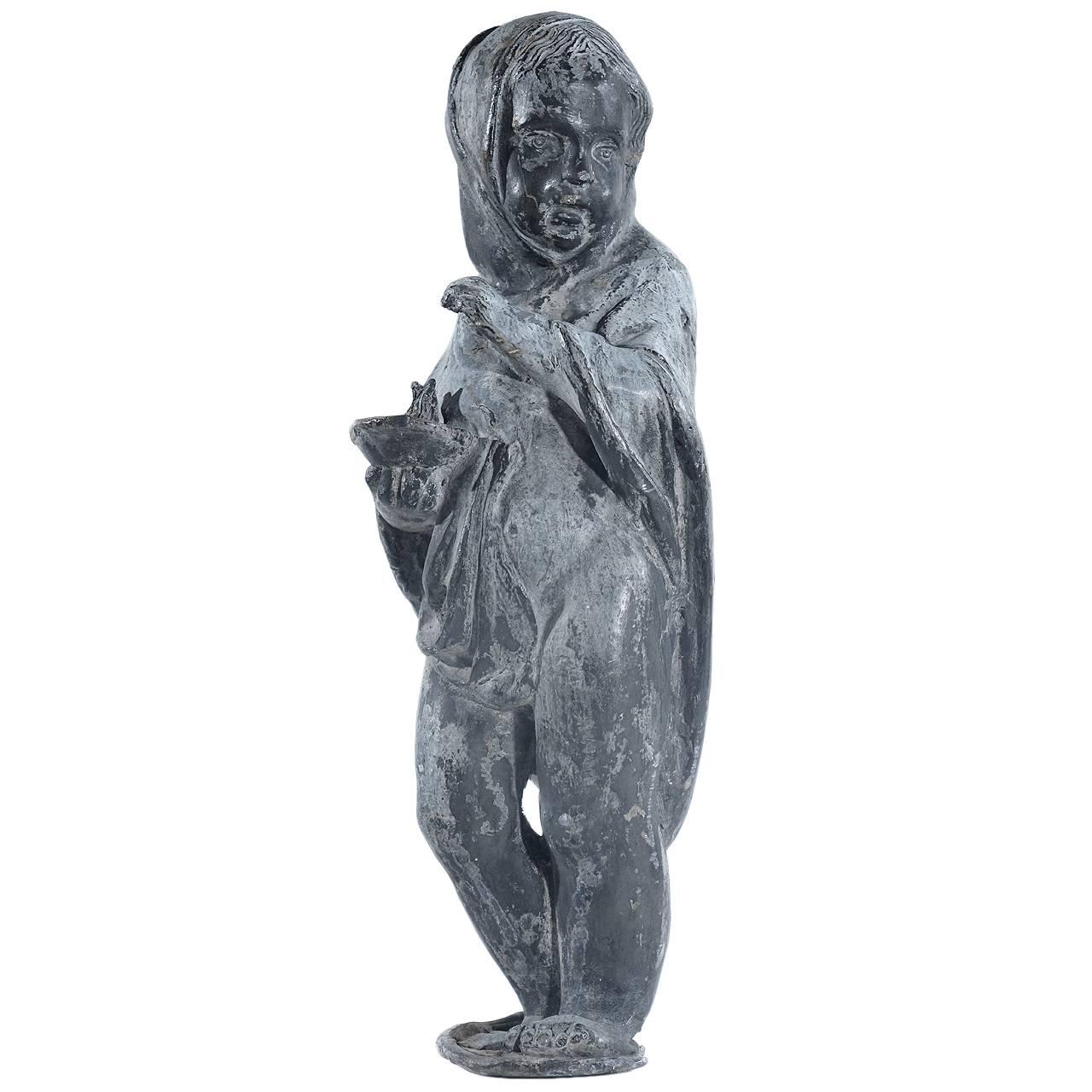 This is a 20 inch statue of a child holding a flame. The sculpture mislead and surprisingly heavy for its size. The patina is beautiful.