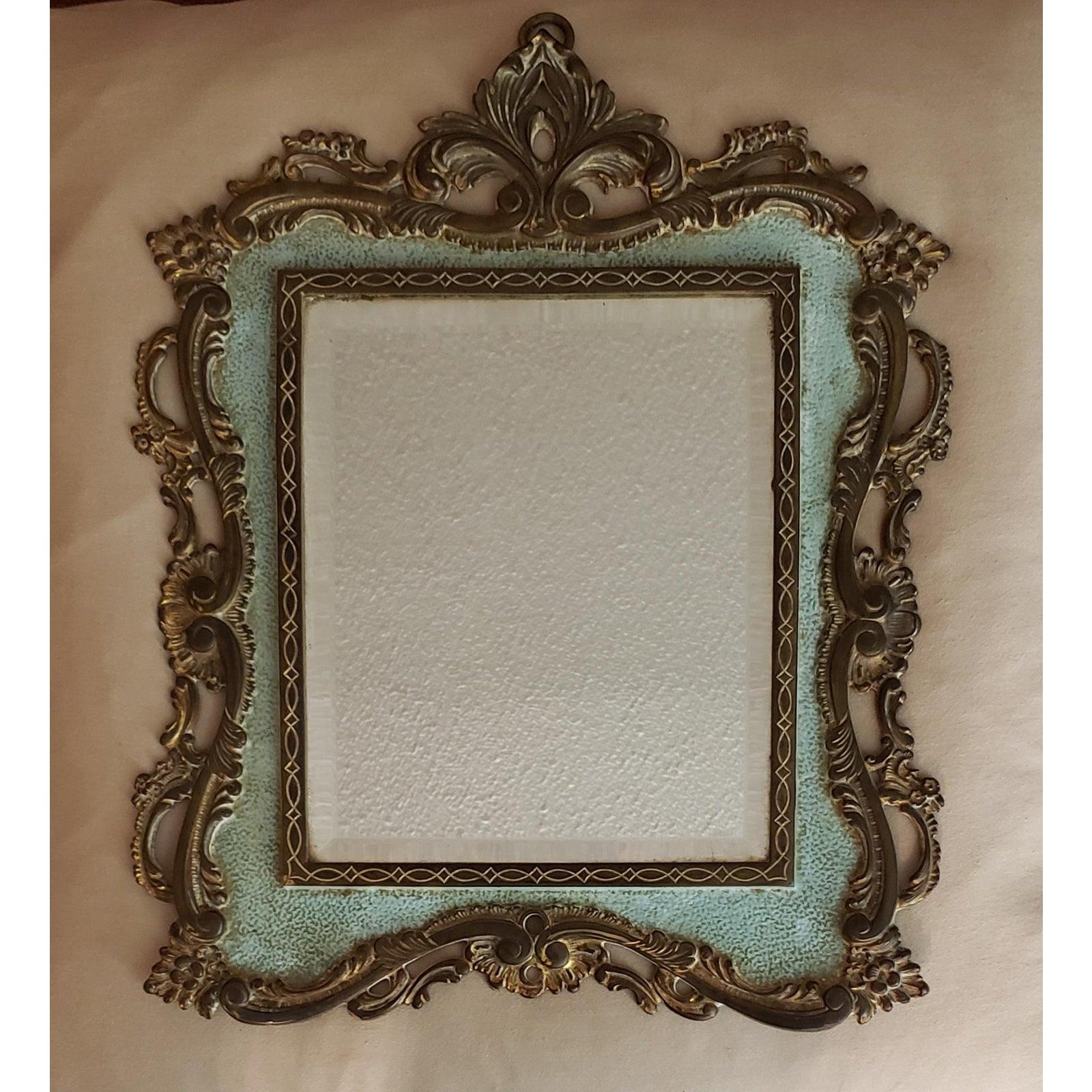 This elegant late 1800s framed wall mirror was made by the National Brass & Iron Works of Reading, PA, which was established in 1891. NB & IW specialized in manufacturing fine decorative brass and iron objects until it went out of business in
