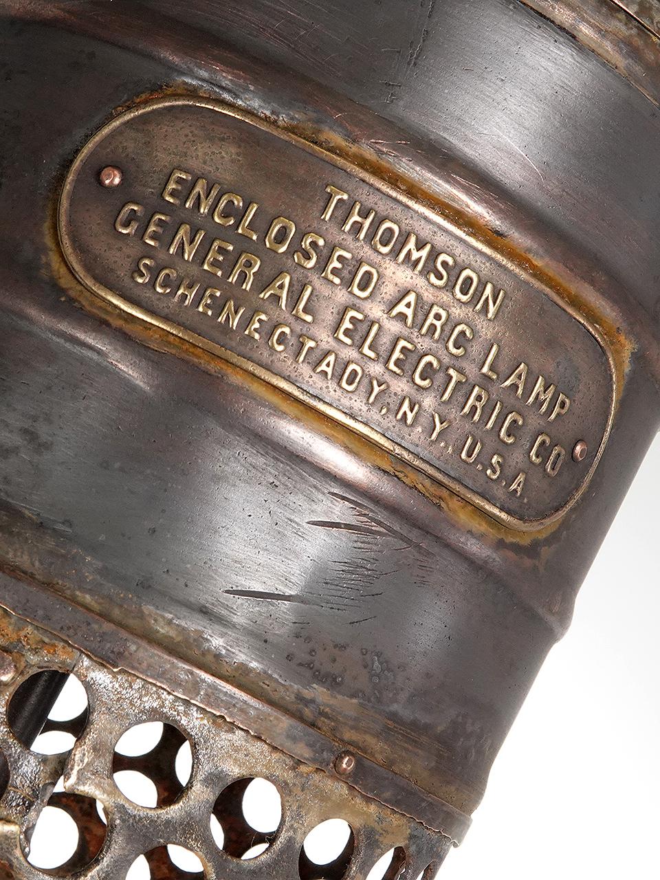 This beautiful lamp goes back to the beginning of electricity and is one of the very earliest street lamps. It is made up from milk glass, copper, brass and cast iron. The patina is just right with a large cast brass plaque that reads... Thomson
