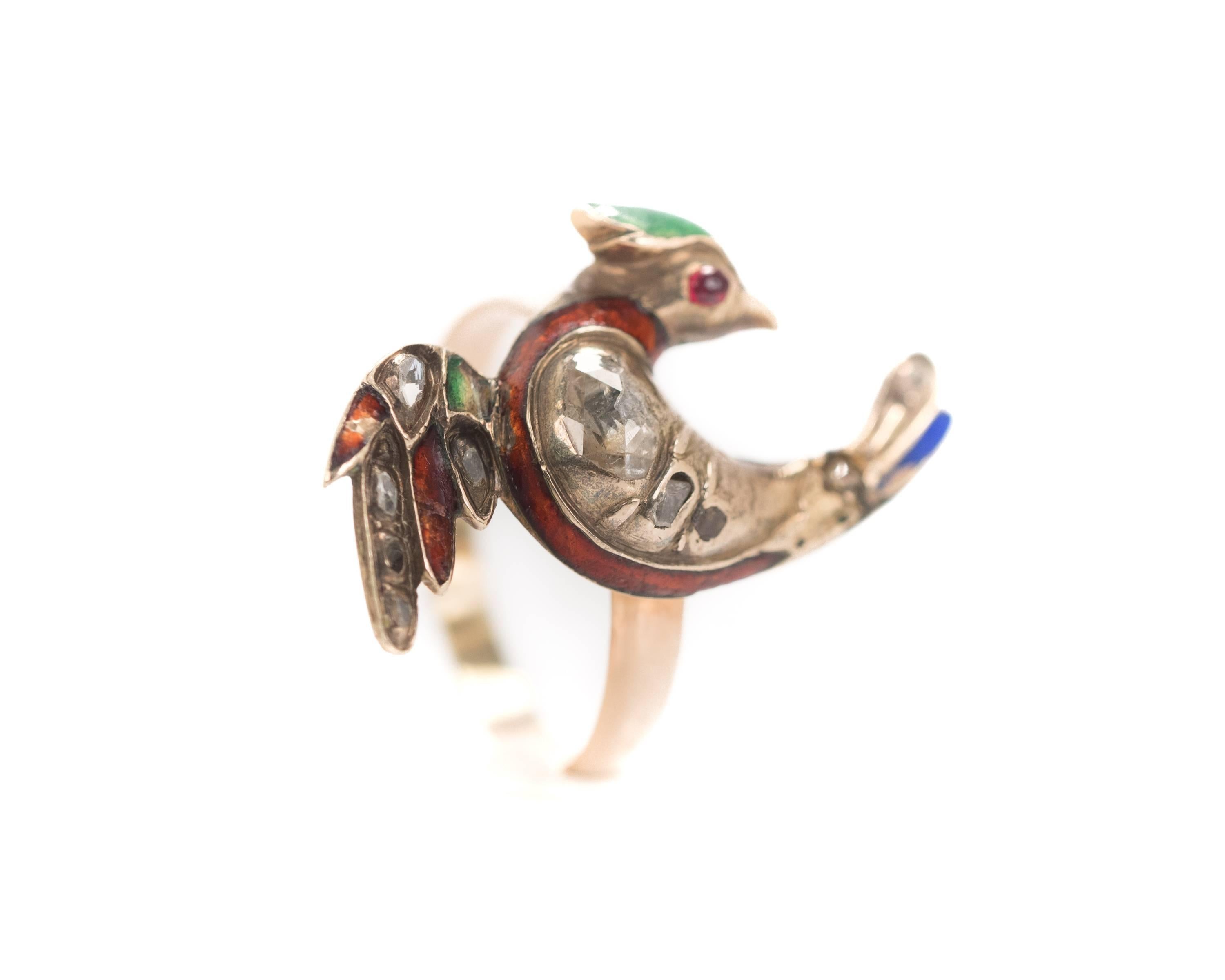 1800s Victorian Antique Bird Ring - 18K & 14K Yellow Gold, Rose Gold, White Gold, Rose cut Diamonds, Ruby, Enamel

Features an 1840s Bird with an 1890s shank. It is crafted from 18K and 14K Yellow, Rose and White Gold. 
This stunning ring is a true